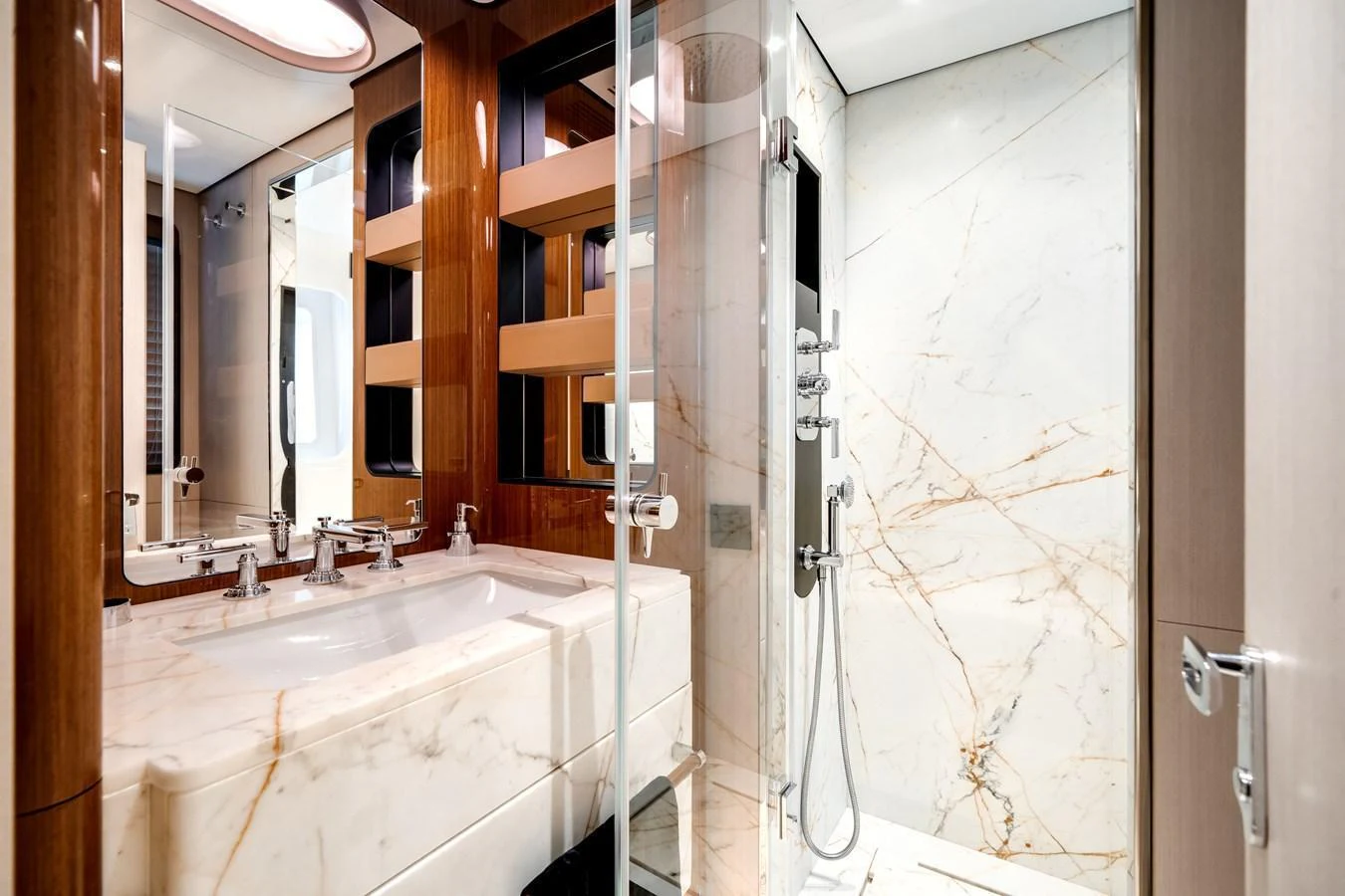 The yacht's bathroom features luxurious marble finishes and modern fixtures. aboard TYCOON Yacht for Sale