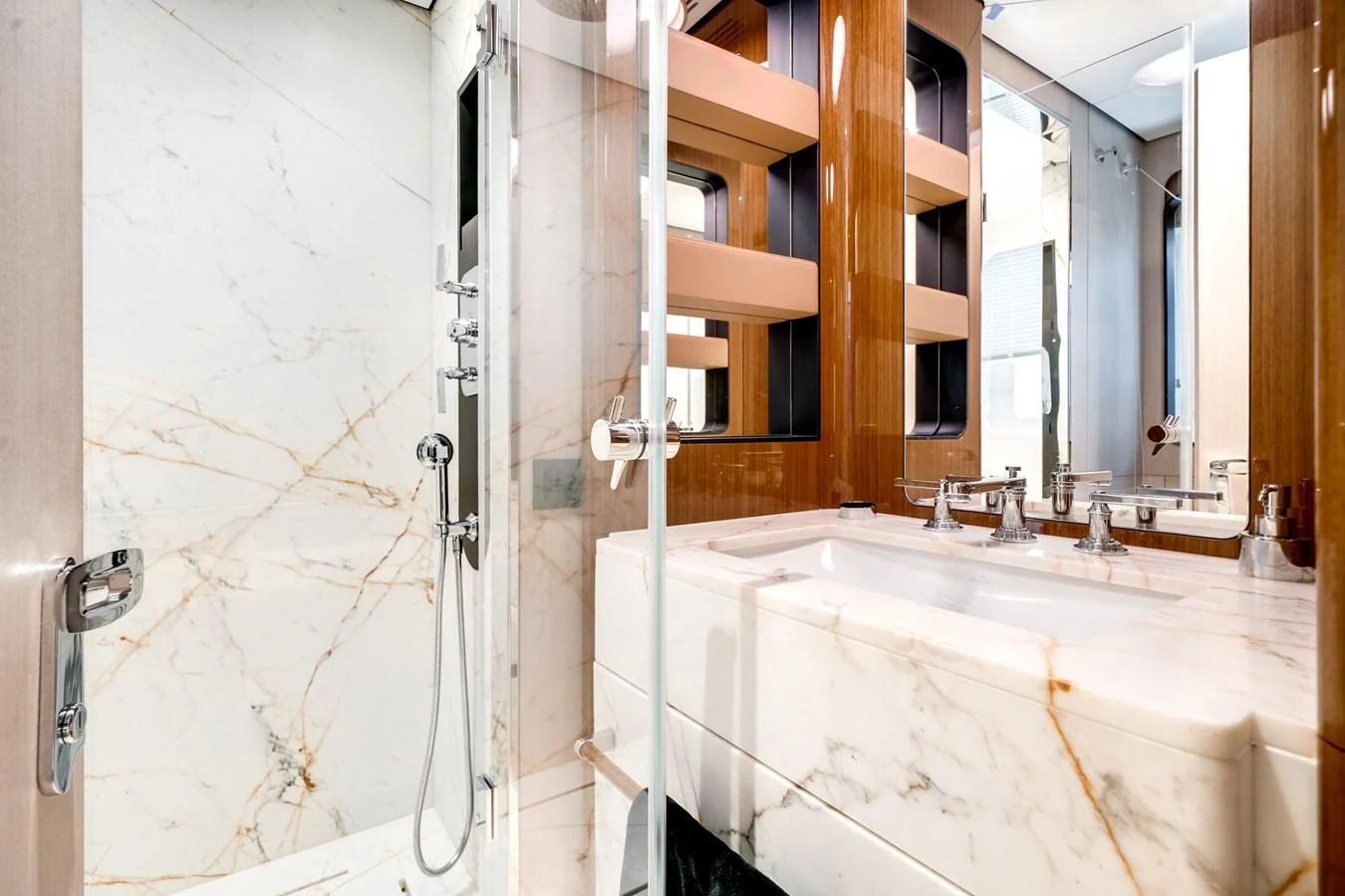 The yacht's bathroom features luxurious marble finishes and modern fixtures. aboard TYCOON Yacht for Sale