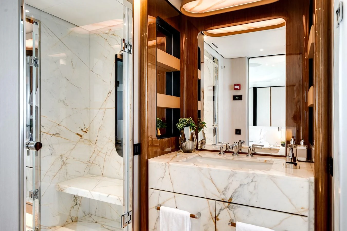 A luxurious yacht bathroom featuring elegant marble surfaces and modern fixtures. aboard TYCOON Yacht for Sale