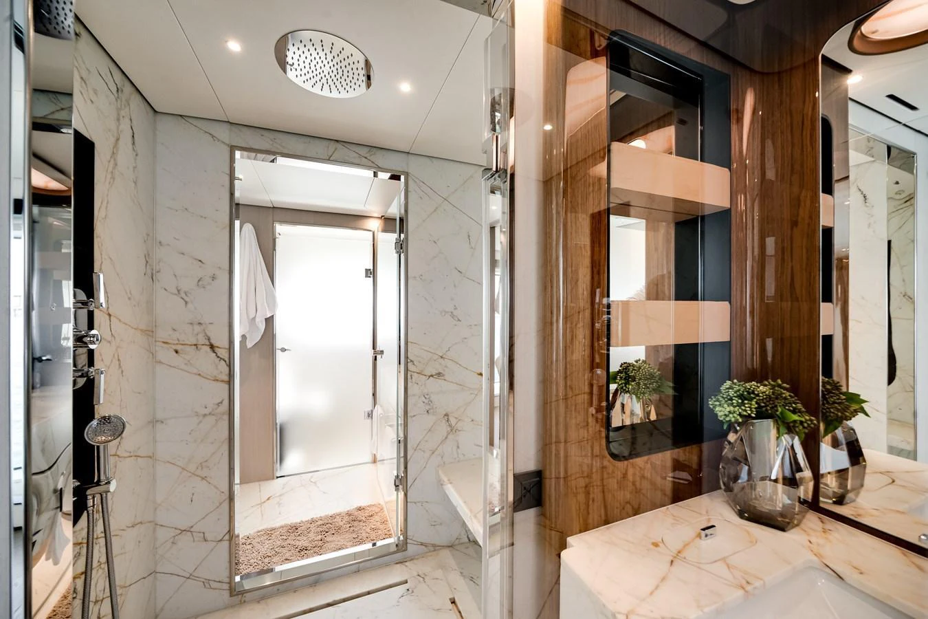 The yacht's bathroom features luxurious marble finishes and modern fixtures. aboard TYCOON Yacht for Sale