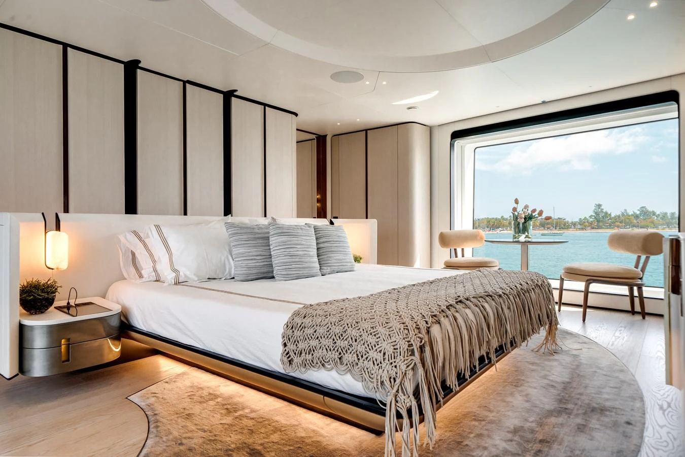 The master stateroom offers a luxurious and serene retreat with a stunning view of the water. aboard TYCOON Yacht for Sale
