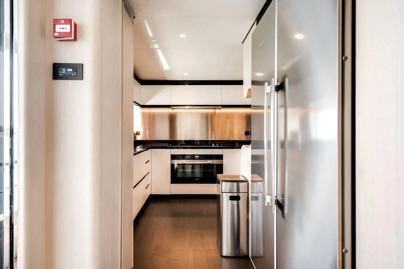 The modern galley features sleek appliances and ample storage for a luxurious culinary experience. aboard TYCOON Yacht for Sale