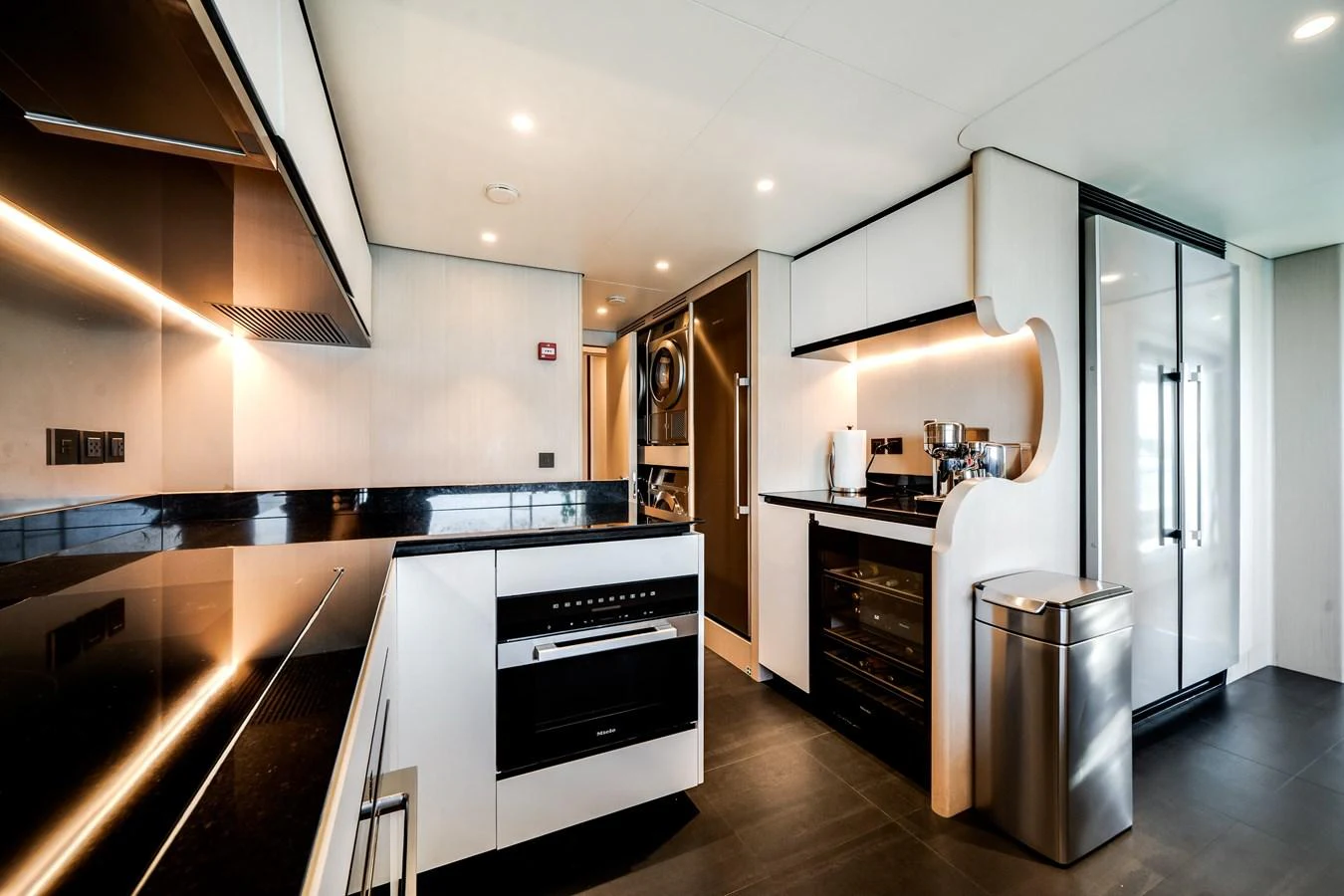 The modern galley features sleek appliances and ample counter space, perfect for gourmet cooking at sea. aboard TYCOON Yacht for Sale