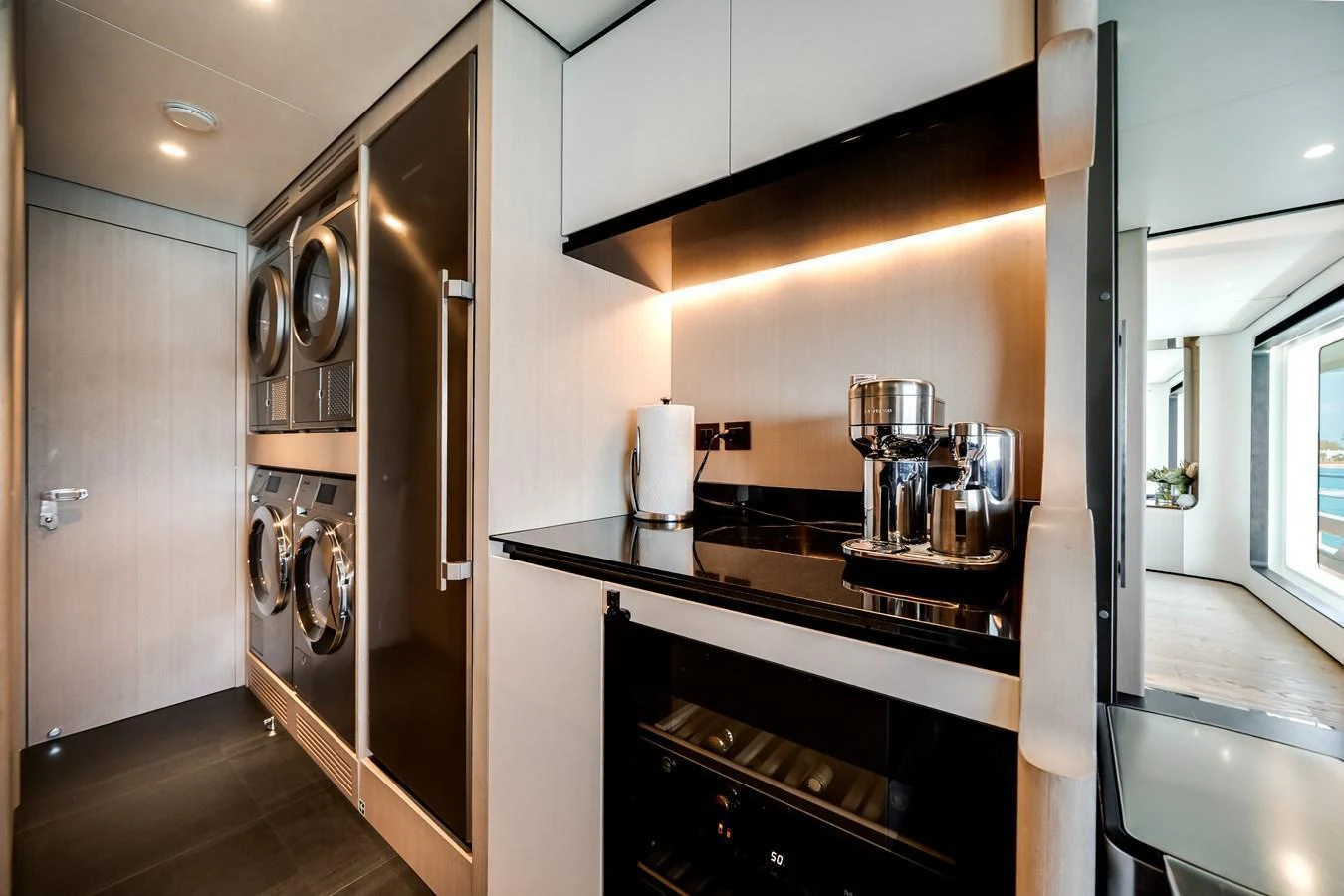 The yacht's galley is equipped with modern appliances and sleek finishes, offering a functional and stylish space. aboard TYCOON Yacht for Sale