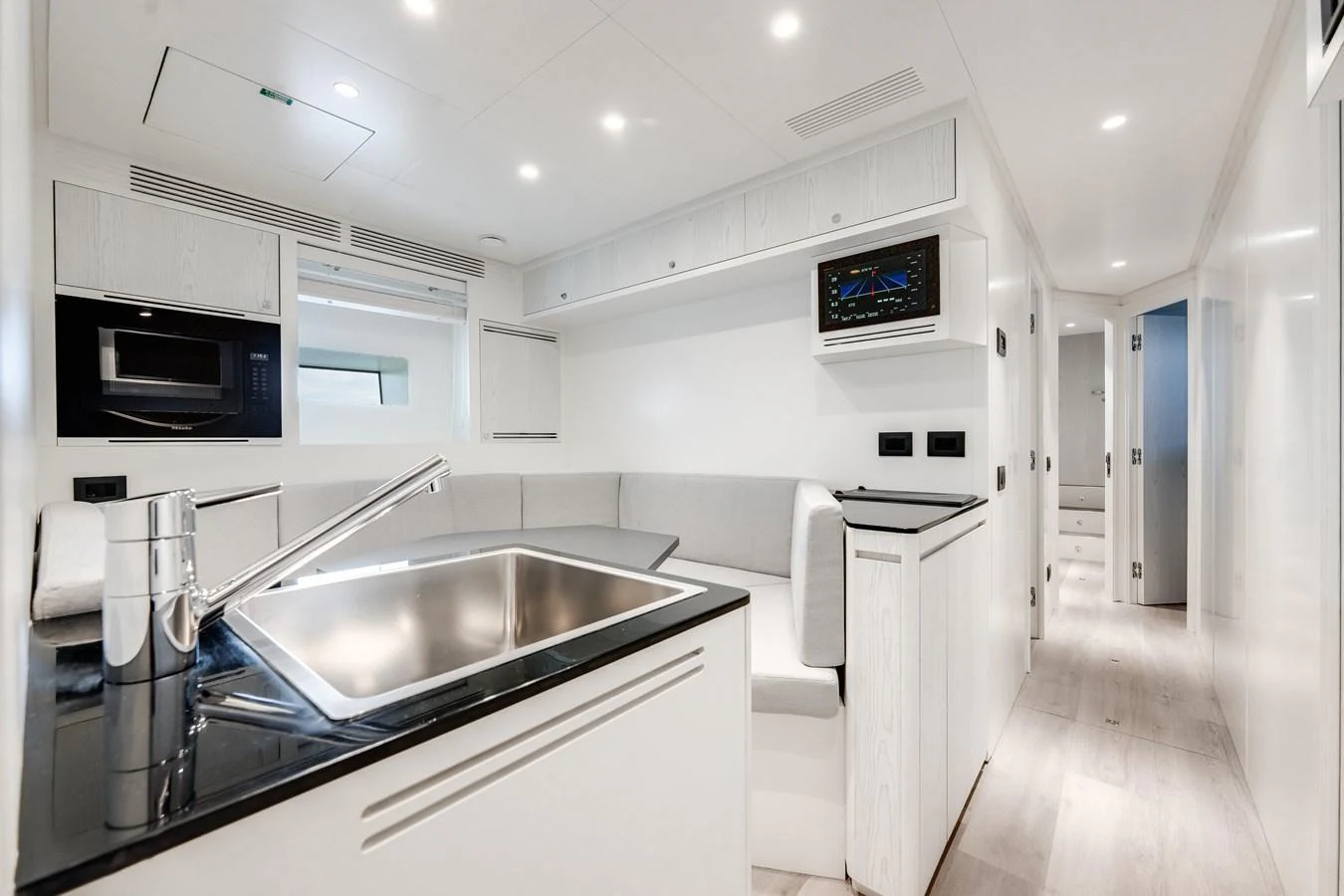 The sleek and modern galley features high-end appliances and a minimalist design. aboard TYCOON Yacht for Sale