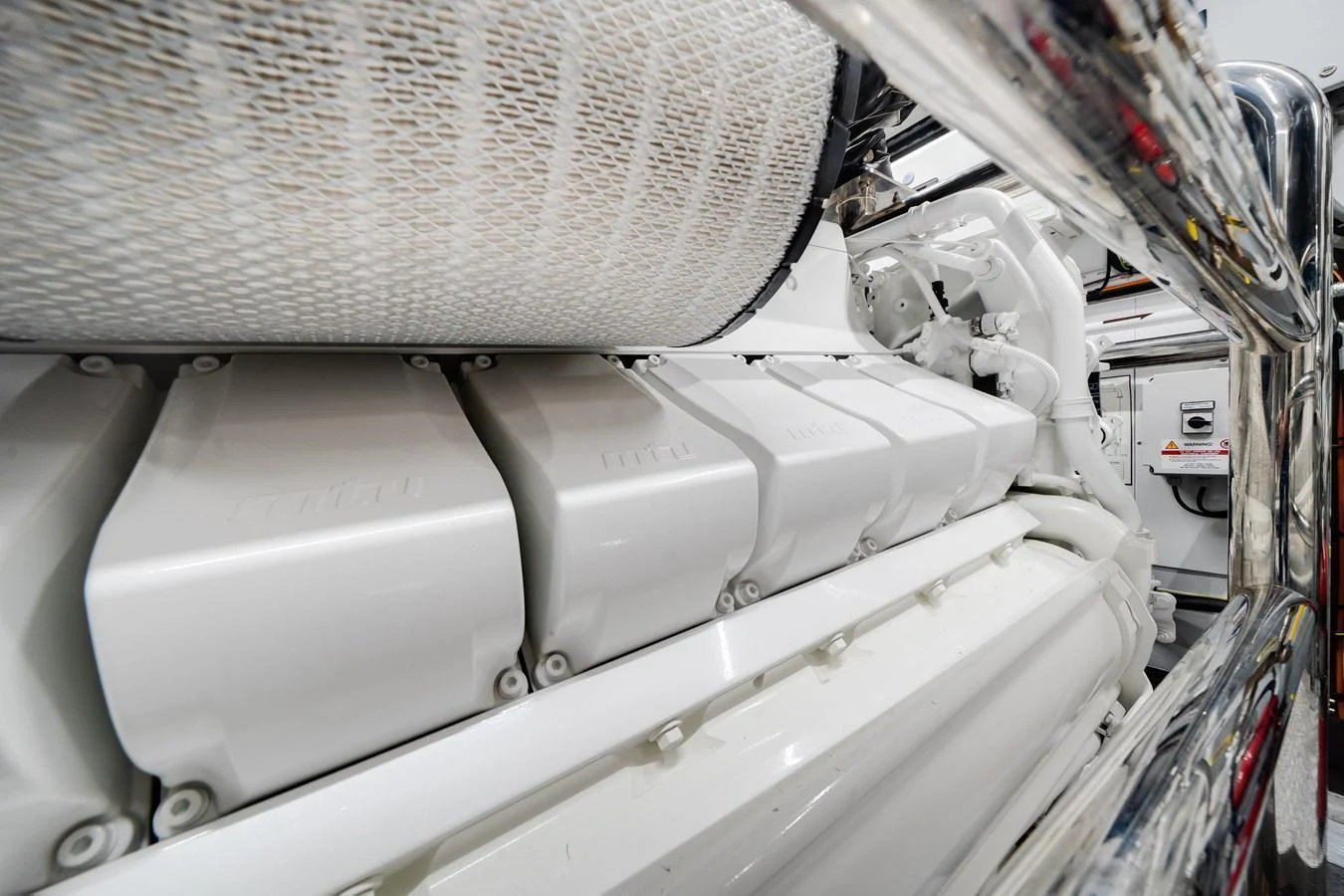 A close-up view of the yacht's pristine engine room showcasing the powerful machinery. aboard TYCOON Yacht for Sale
