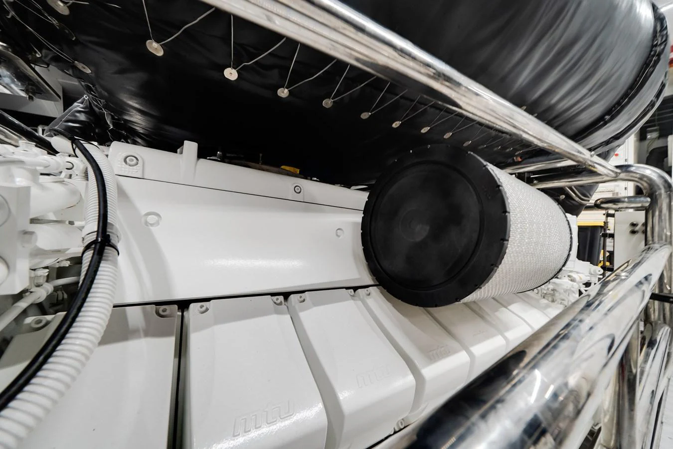 A close-up view of the yacht's engine room showcasing the mechanical components. aboard TYCOON Yacht for Sale