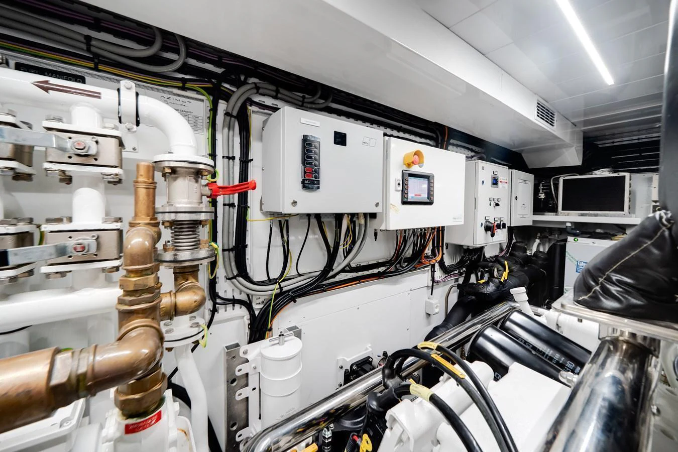 The engine room showcases advanced machinery and control systems, ensuring peak performance and reliability. aboard TYCOON Yacht for Sale
