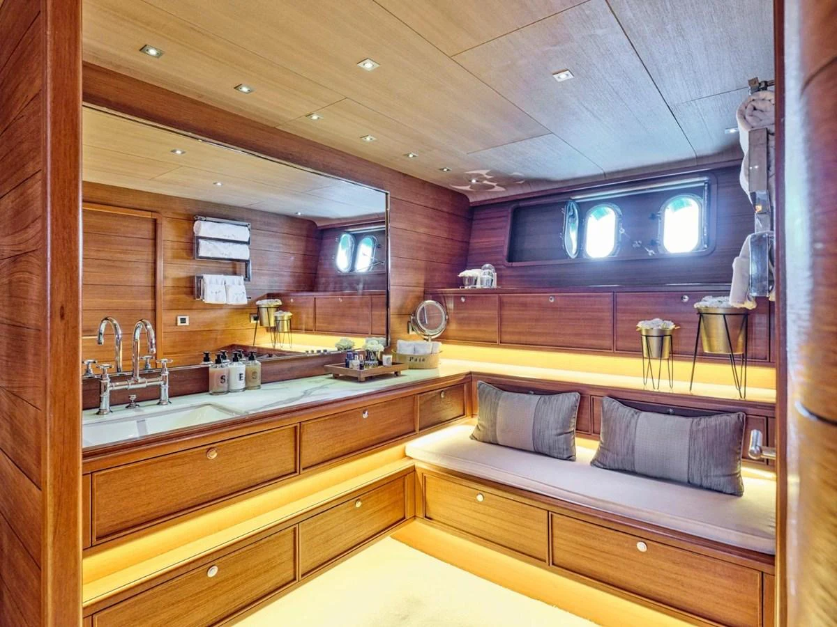 a bathroom with a large mirror aboard PASA Yacht for Sale