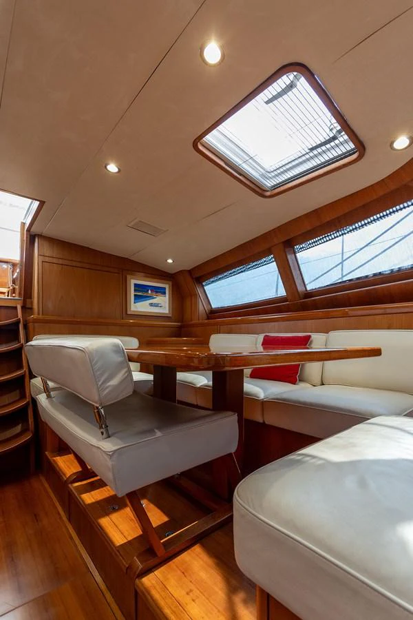 a room with a couch and a window aboard SKIP'N BOU Yacht for Sale