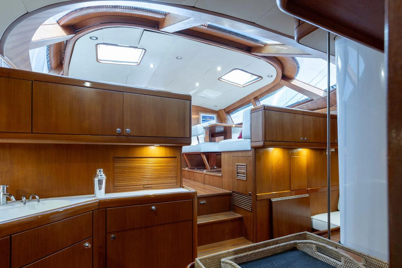 a kitchen with wooden cabinets aboard SKIP'N BOU Yacht for Sale
