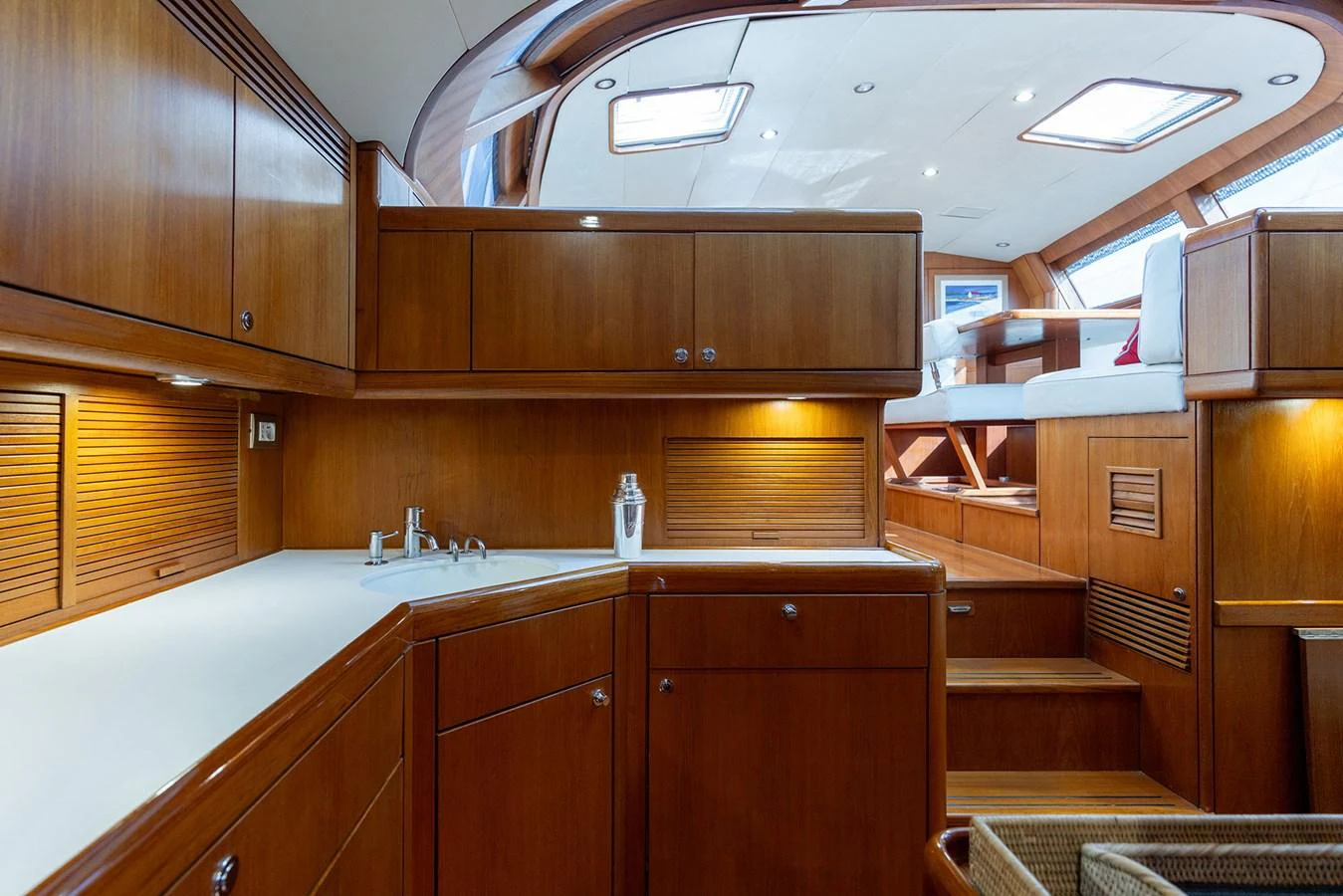 a kitchen with wooden cabinets aboard SKIP'N BOU Yacht for Sale