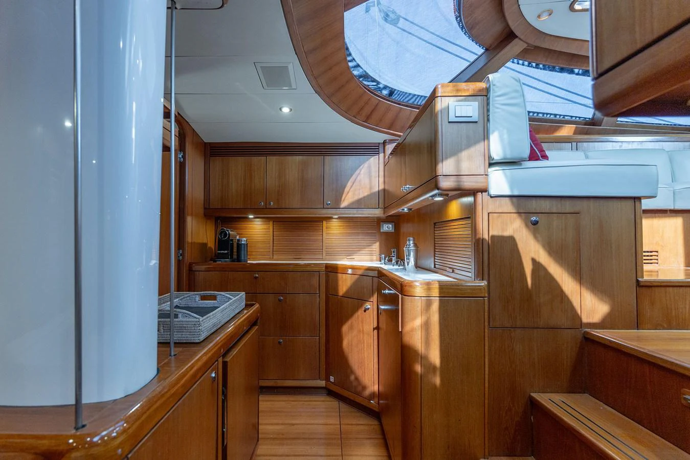a kitchen with wooden cabinets aboard SKIP'N BOU Yacht for Sale