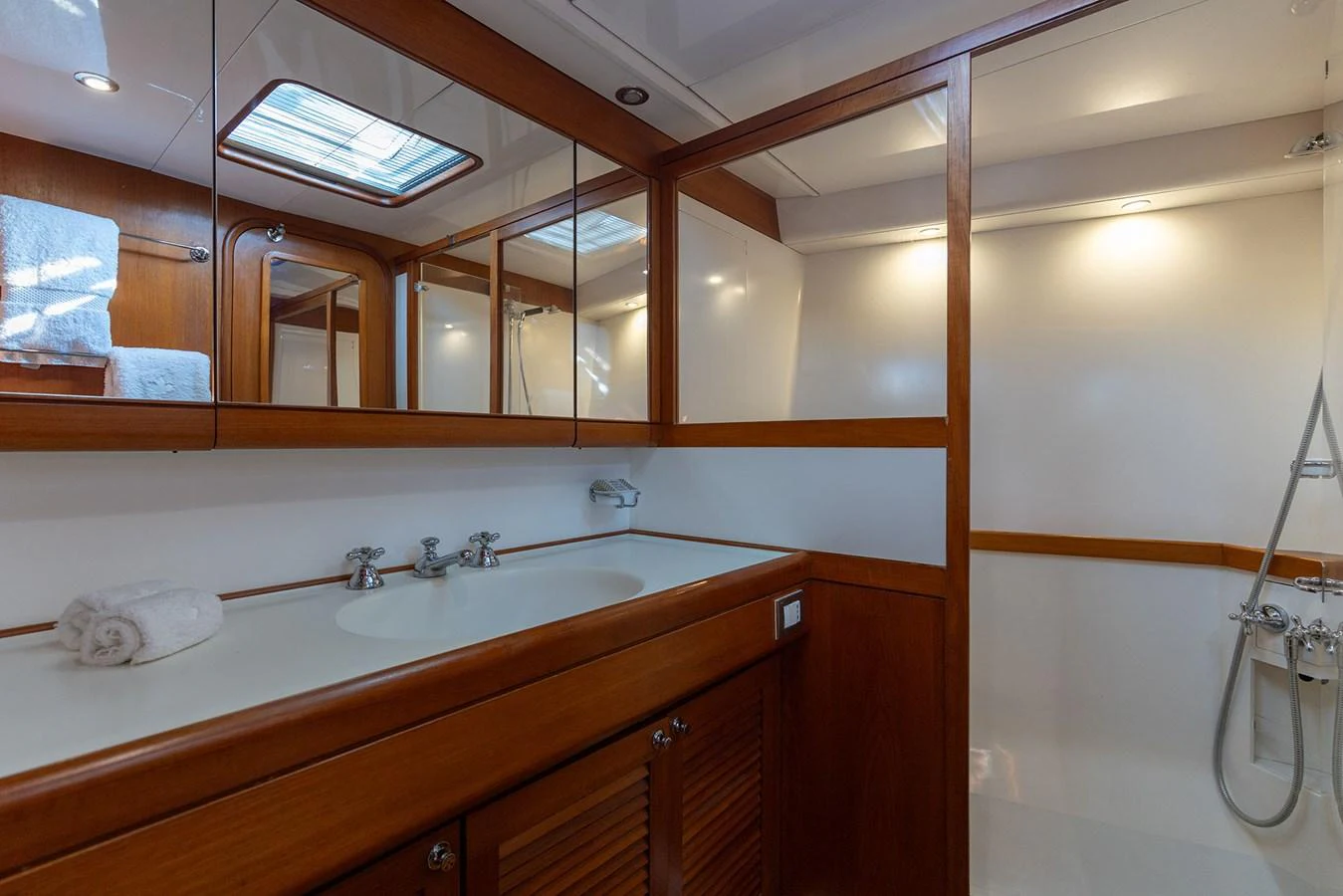 a bathroom with a sink and a mirror aboard SKIP'N BOU Yacht for Sale