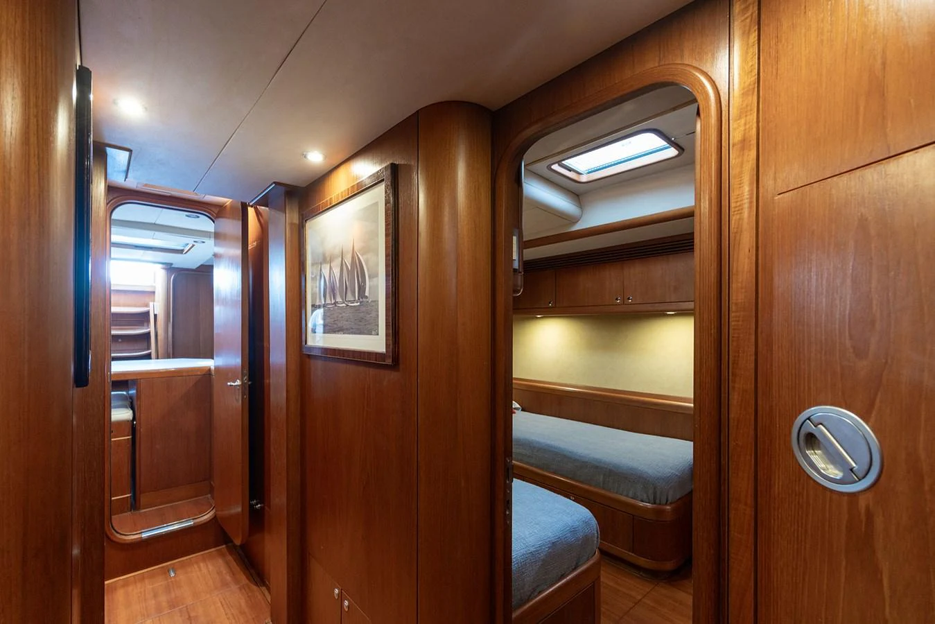 a room with a wood door and a bed in it aboard SKIP'N BOU Yacht for Sale