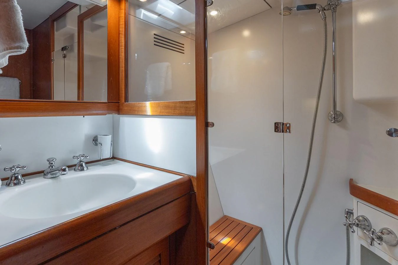 a bathroom with a shower and sink aboard SKIP'N BOU Yacht for Sale