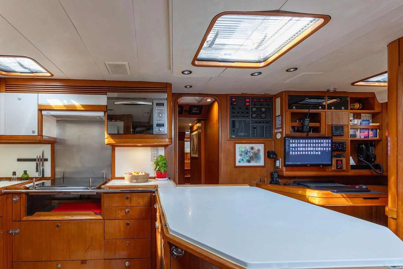a large kitchen with a large island aboard SKIP'N BOU Yacht for Sale