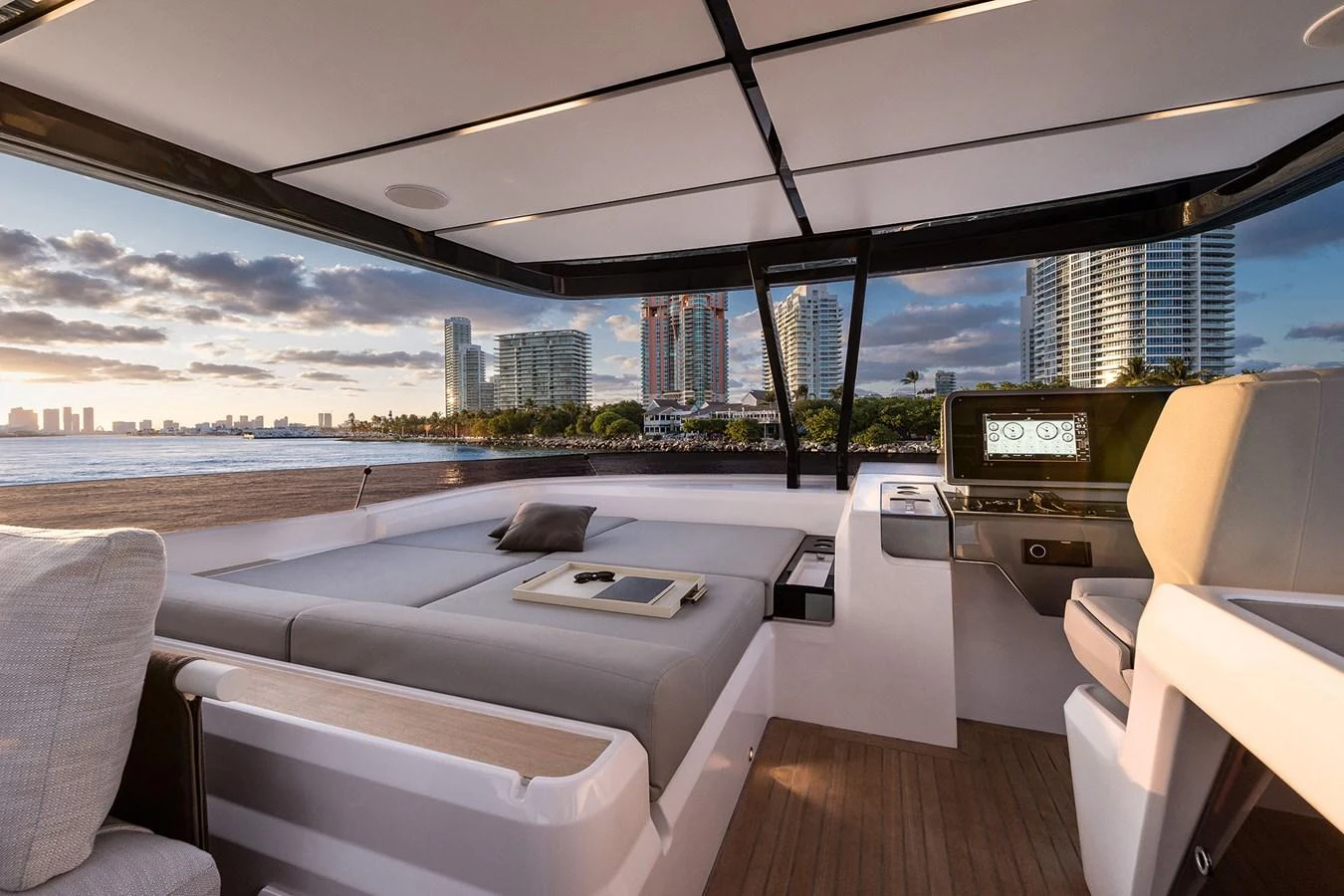 a room with a view of a city and water aboard WL Yacht for Sale