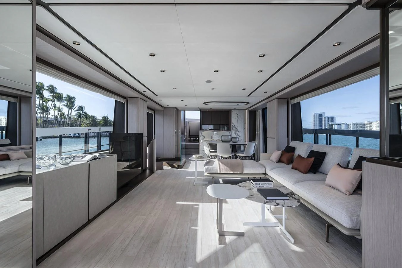 a living room with a large balcony aboard WL Yacht for Sale