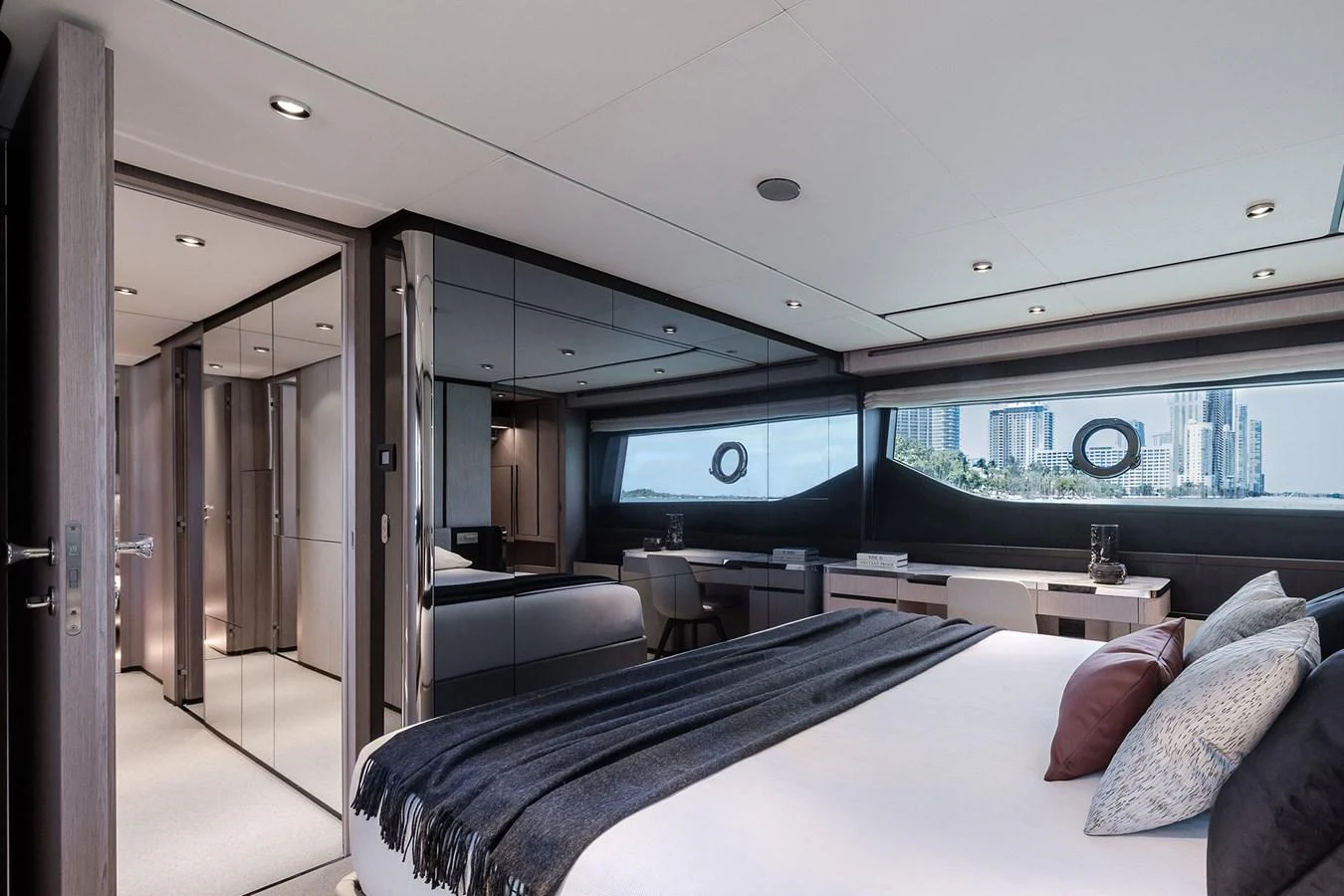 a bedroom with a large window aboard WL Yacht for Sale