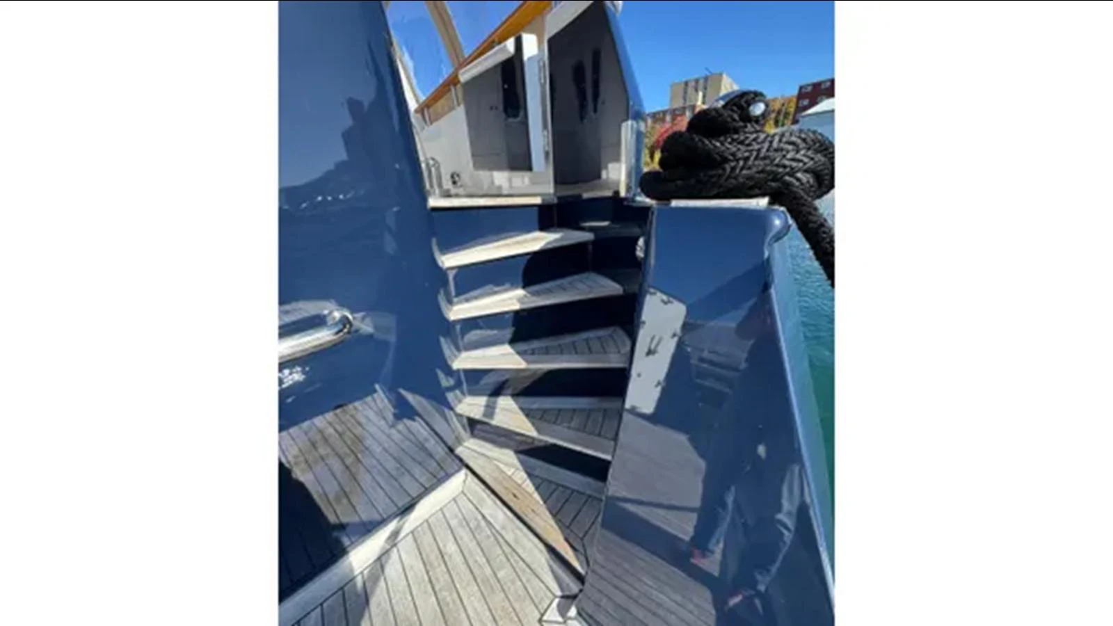 a person standing on a balcony aboard BELLE ISLE SEA Yacht for Sale