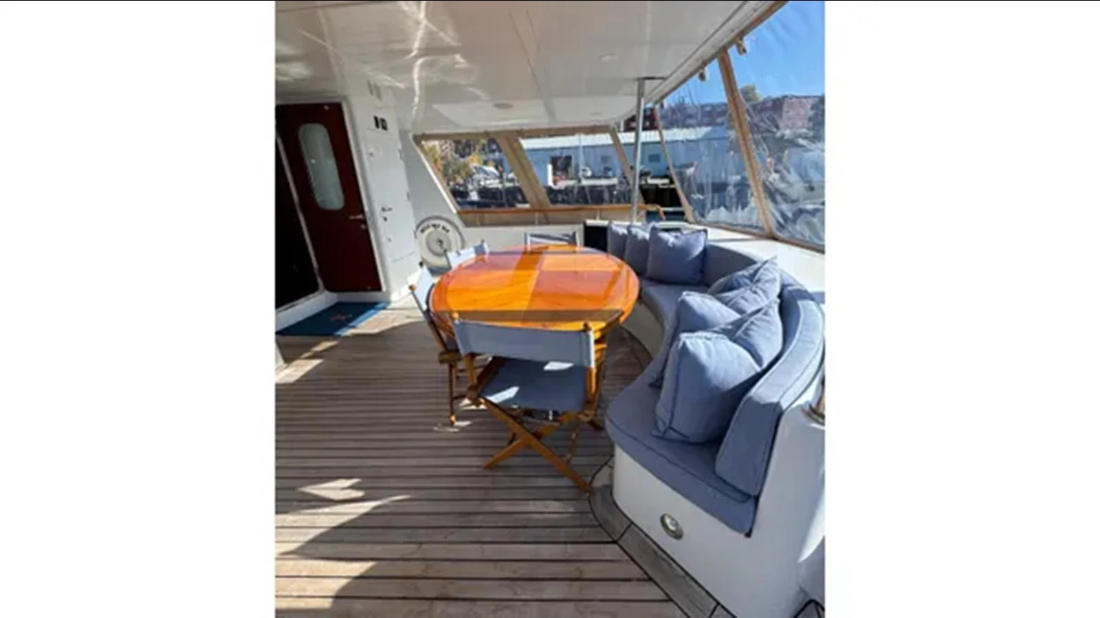 a tent with a couch and a table and chairs aboard BELLE ISLE SEA Yacht for Sale