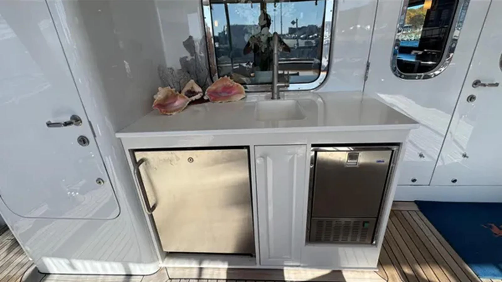 a white microwave with a door open aboard BELLE ISLE SEA Yacht for Sale