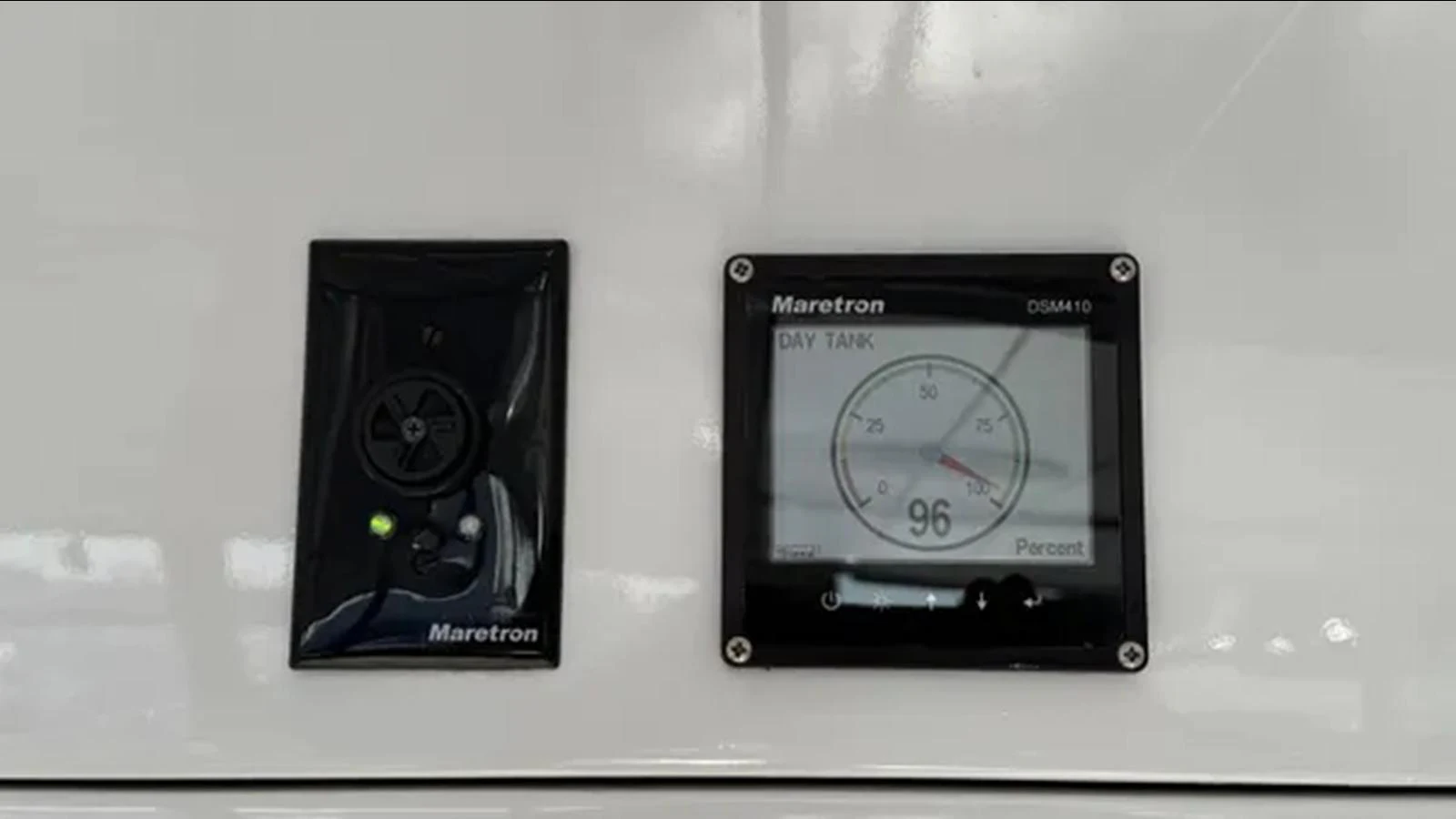 a black rectangular device with a silver face and a black rectangular object aboard BELLE ISLE SEA Yacht for Sale