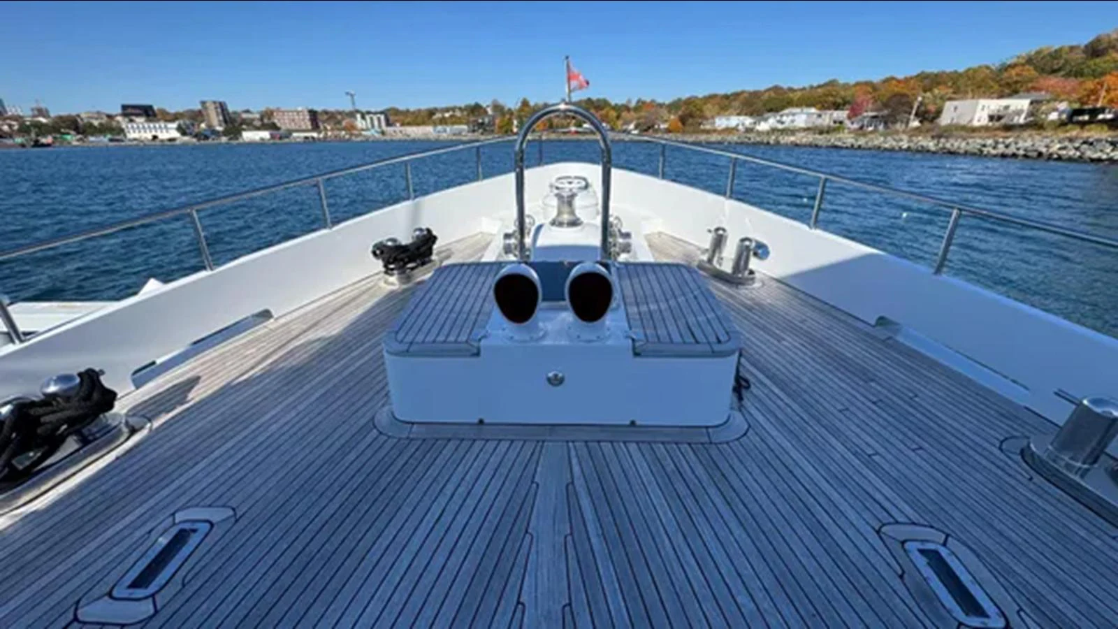 a large white boat on a deck aboard BELLE ISLE SEA Yacht for Sale