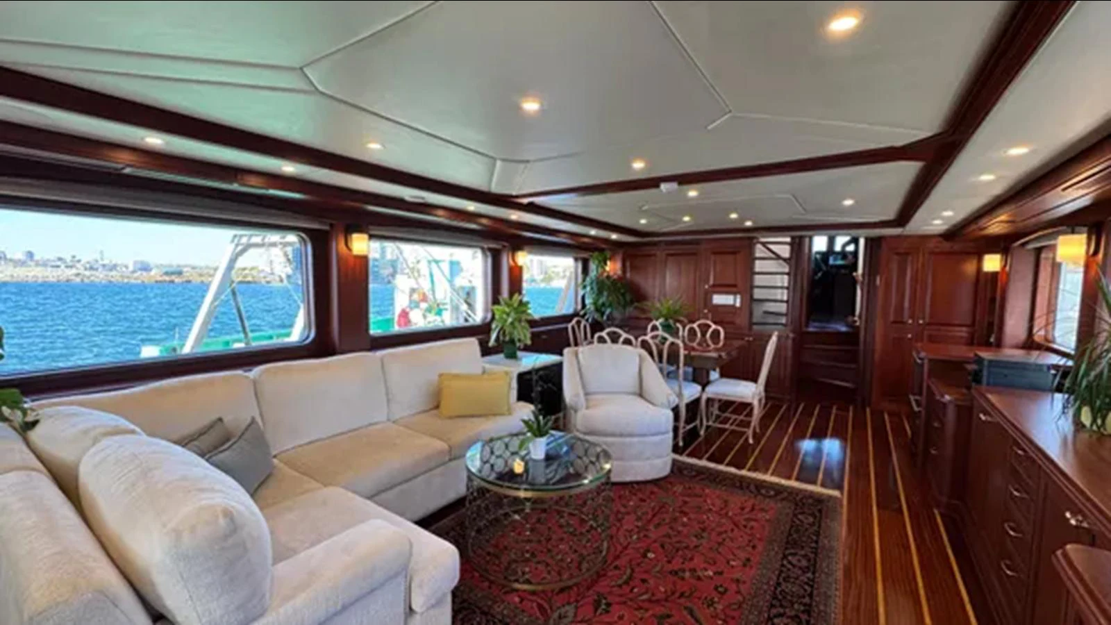 a living room with a large window aboard BELLE ISLE SEA Yacht for Sale