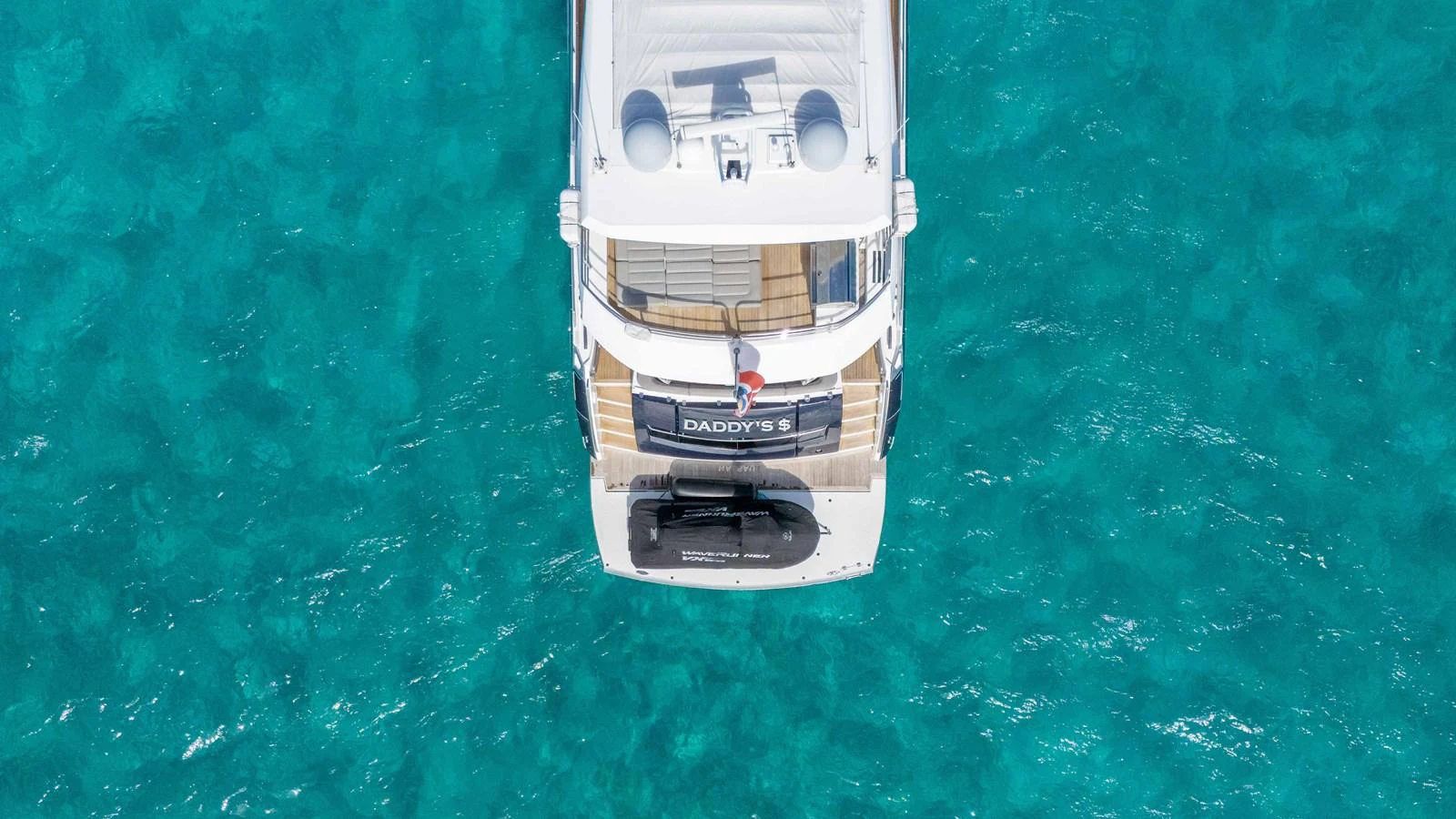 a silver and gold object on a green surface aboard DADDY'S $ Yacht for Sale