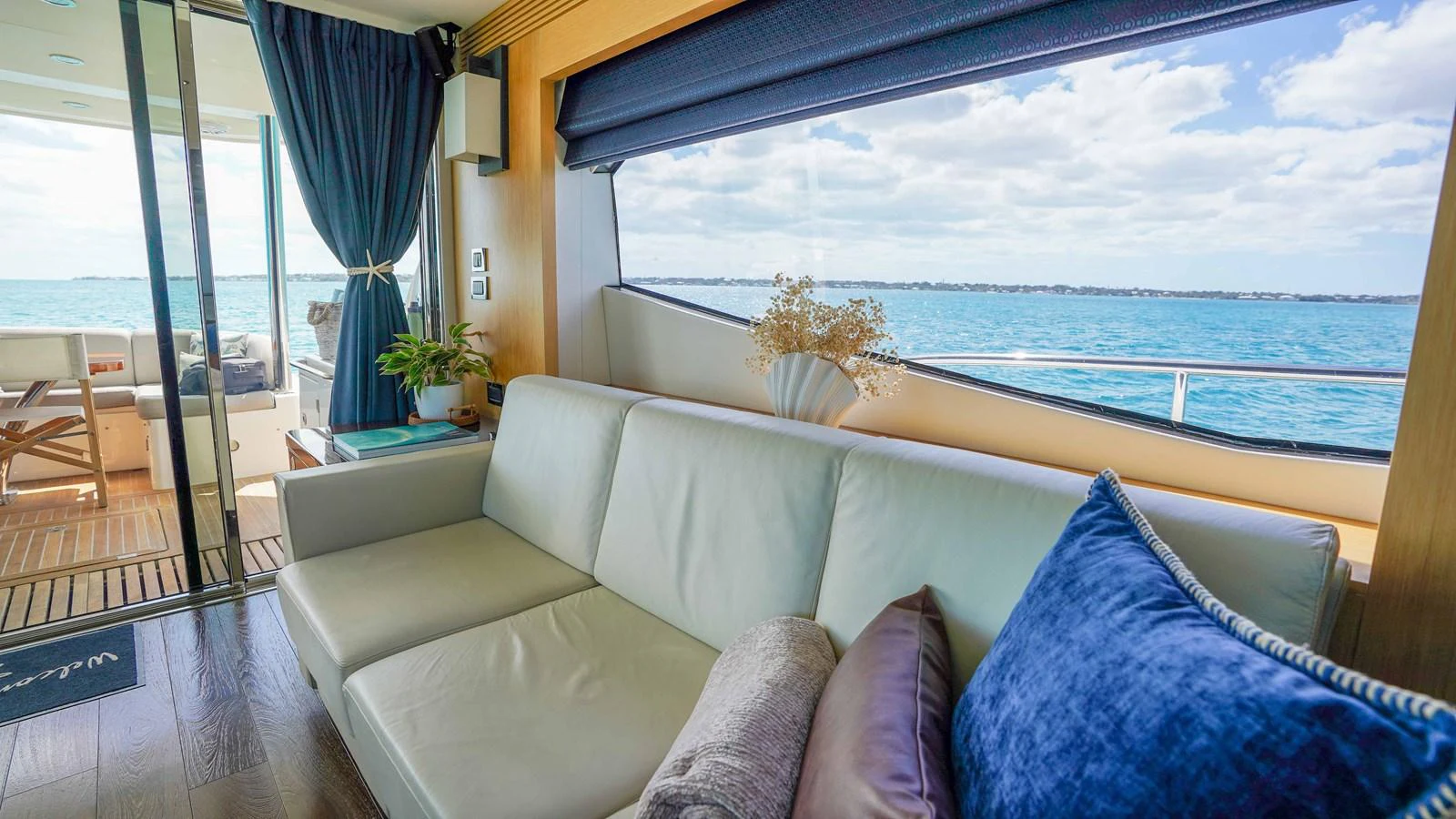 a living room with a large window aboard DADDY'S $ Yacht for Sale