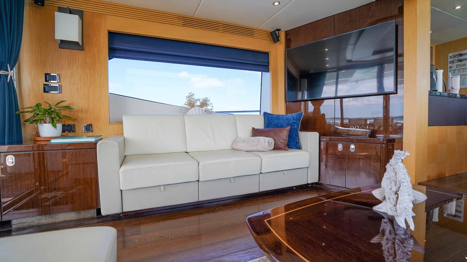 a living room with a white couch aboard DADDY'S $ Yacht for Sale