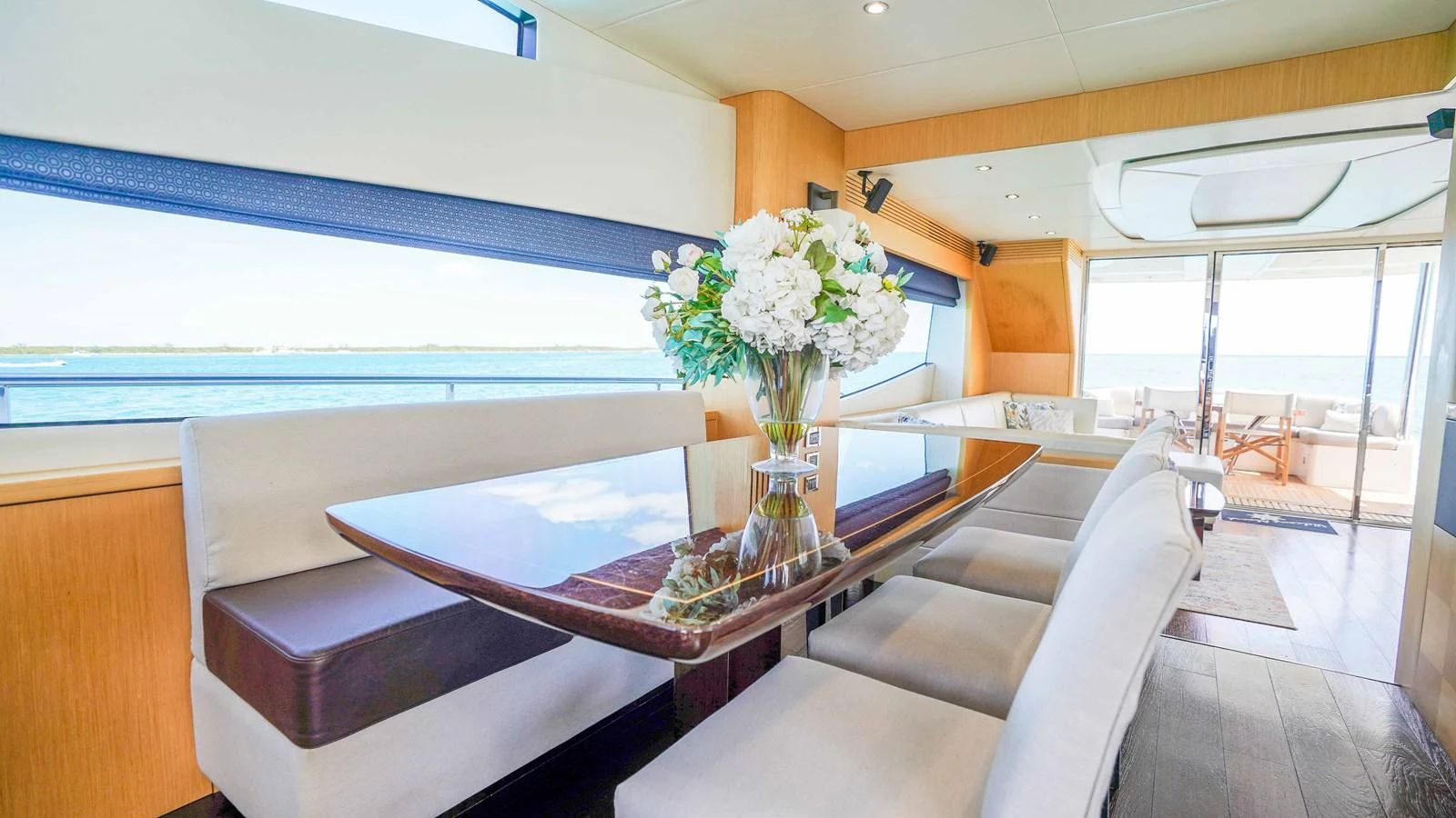a living room with a table and chairs aboard DADDY'S $ Yacht for Sale