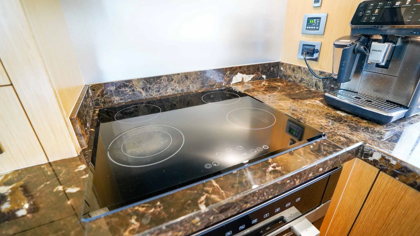 a kitchen with a stove and a microwave aboard DADDY'S $ Yacht for Sale