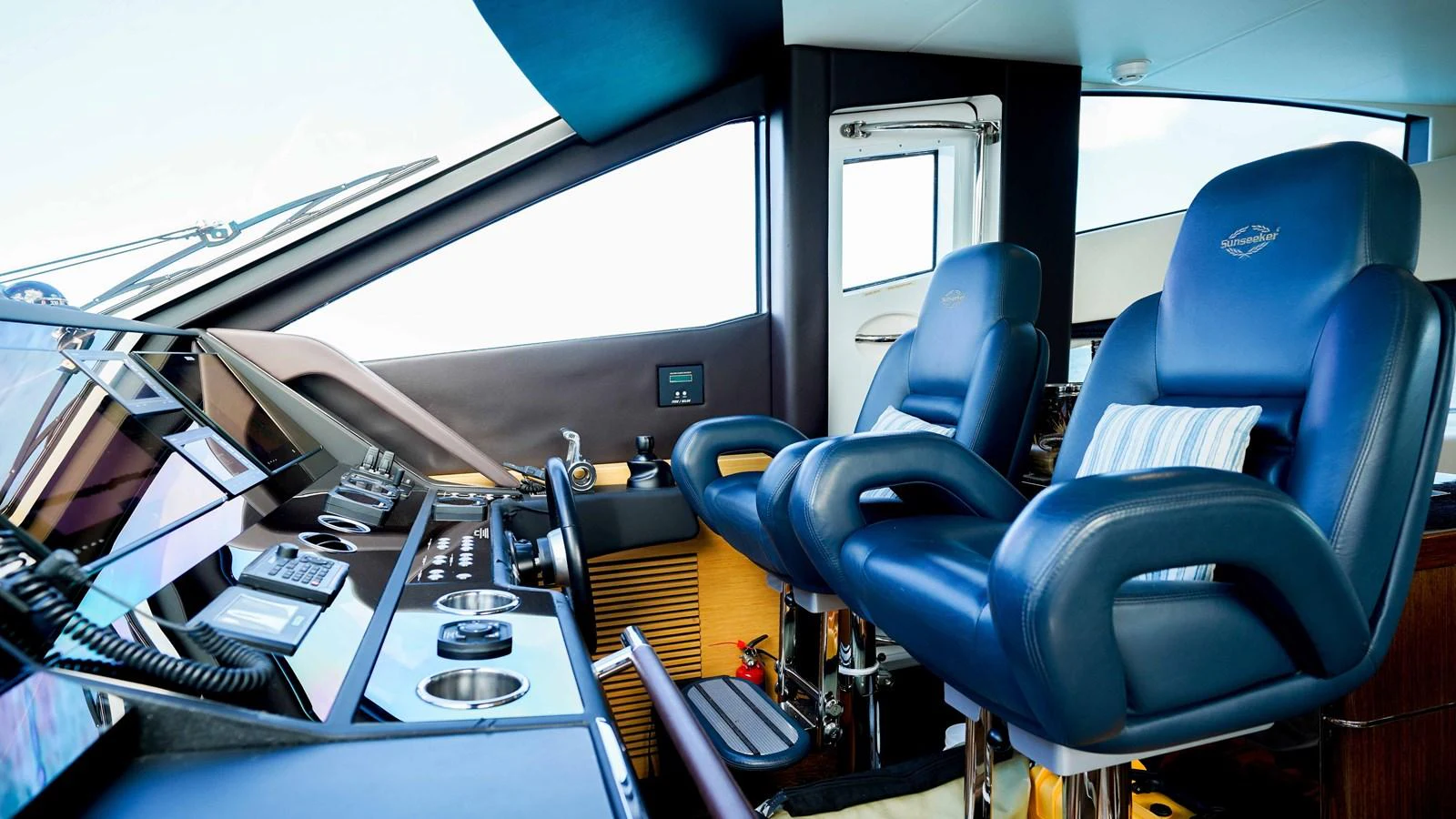 a room with a desk and chairs aboard DADDY'S $ Yacht for Sale