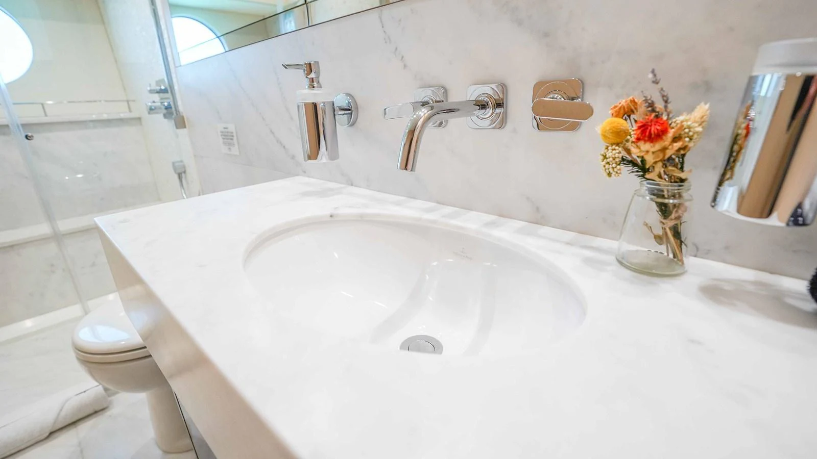 a bathroom with a sink and a toilet aboard DADDY'S $ Yacht for Sale