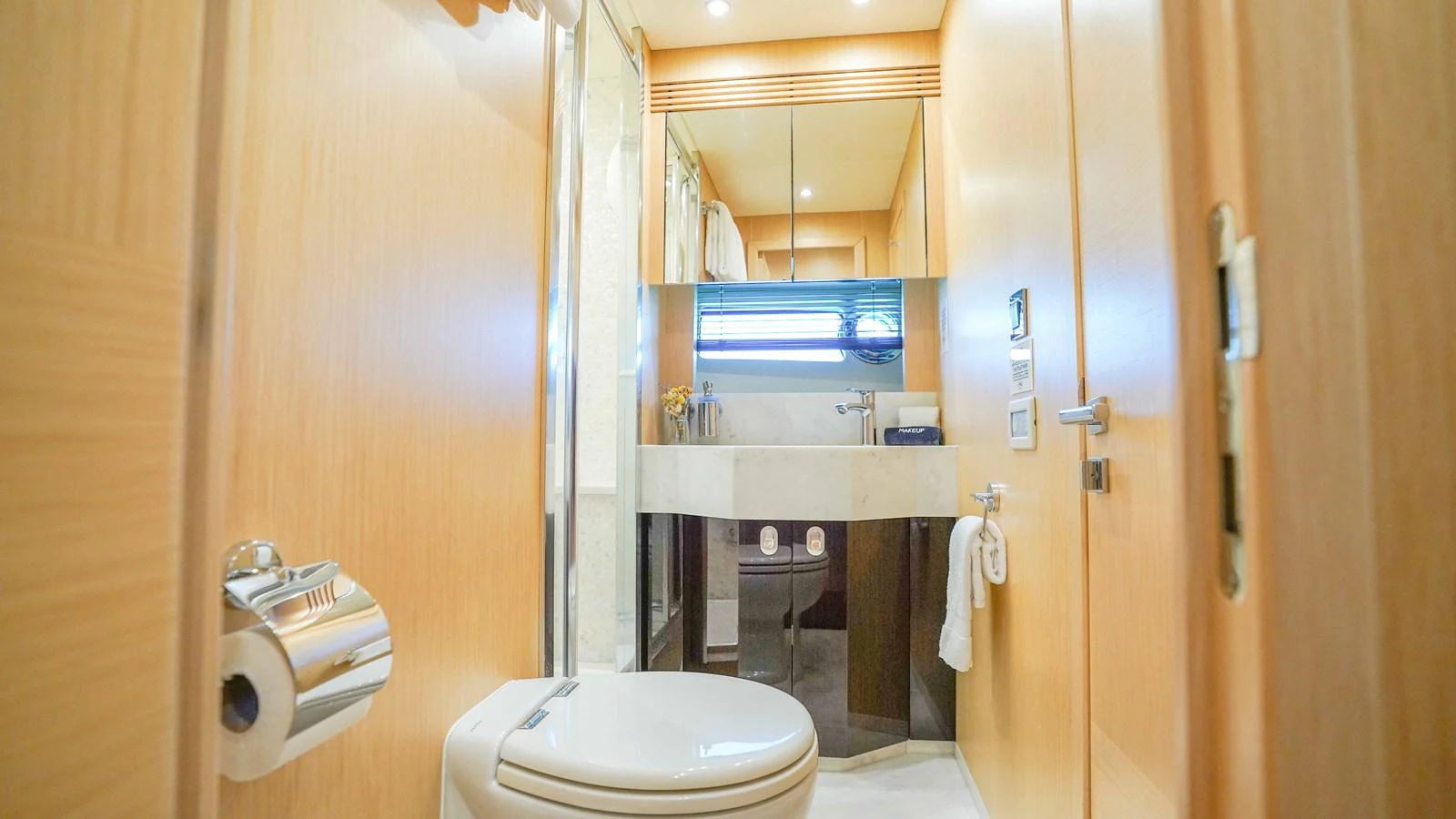a bathroom with a toilet and sink aboard DADDY'S $ Yacht for Sale