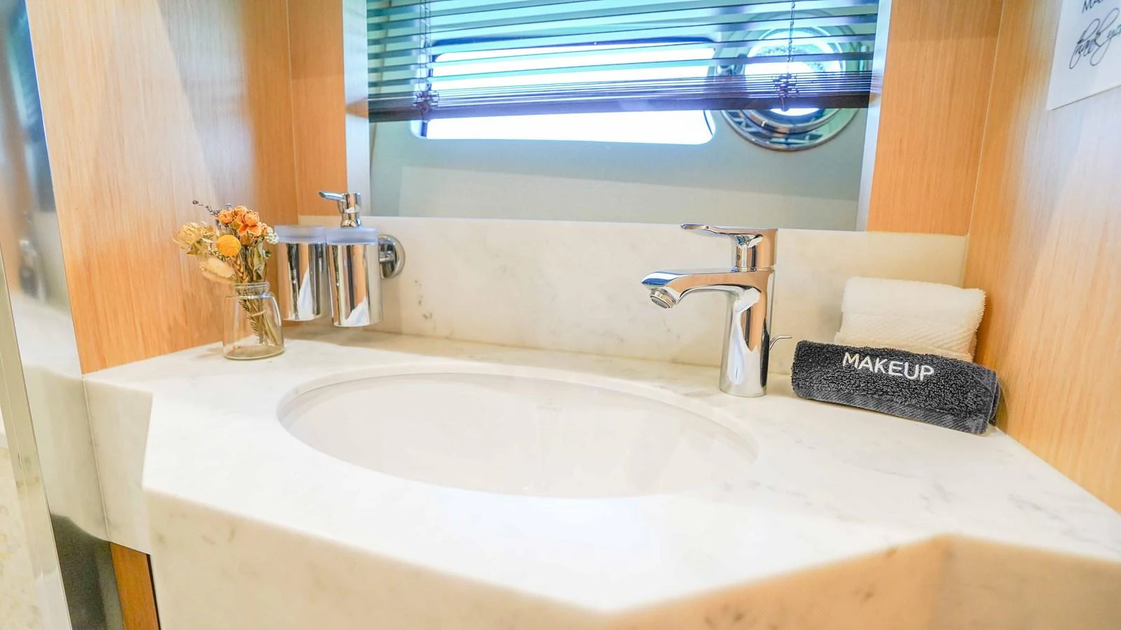 a bathroom with a sink and towels aboard DADDY'S $ Yacht for Sale