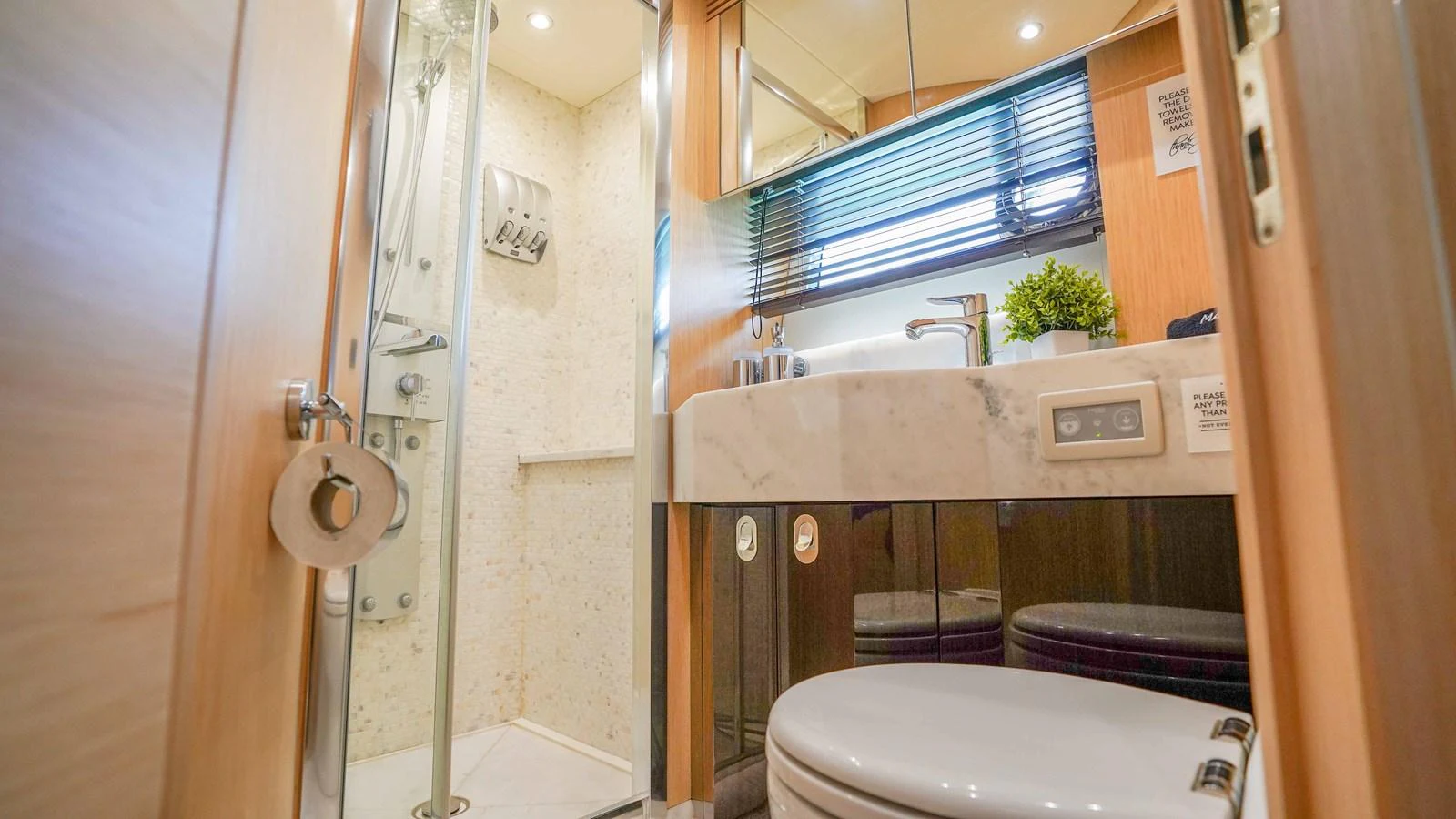 a bathroom with a glass shower aboard DADDY'S $ Yacht for Sale