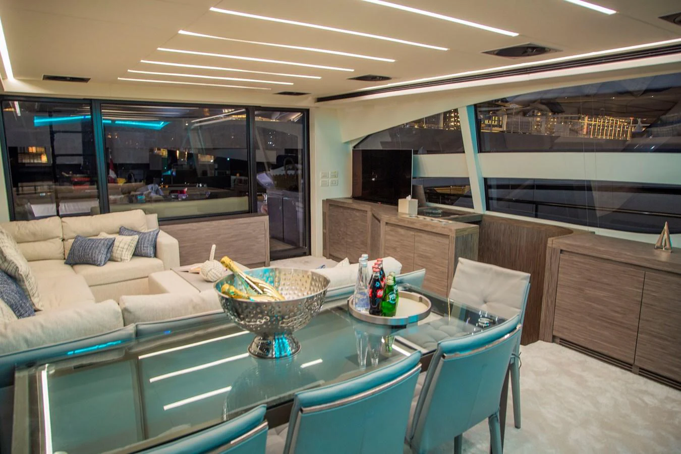 a room with a table and chairs aboard STRAGA Yacht for Sale