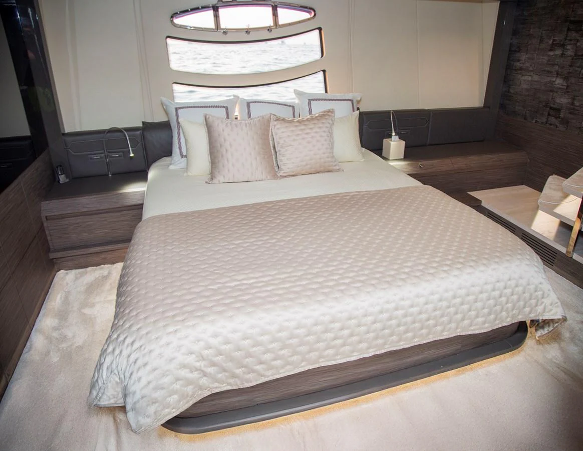 a bed with white sheets aboard STRAGA Yacht for Sale