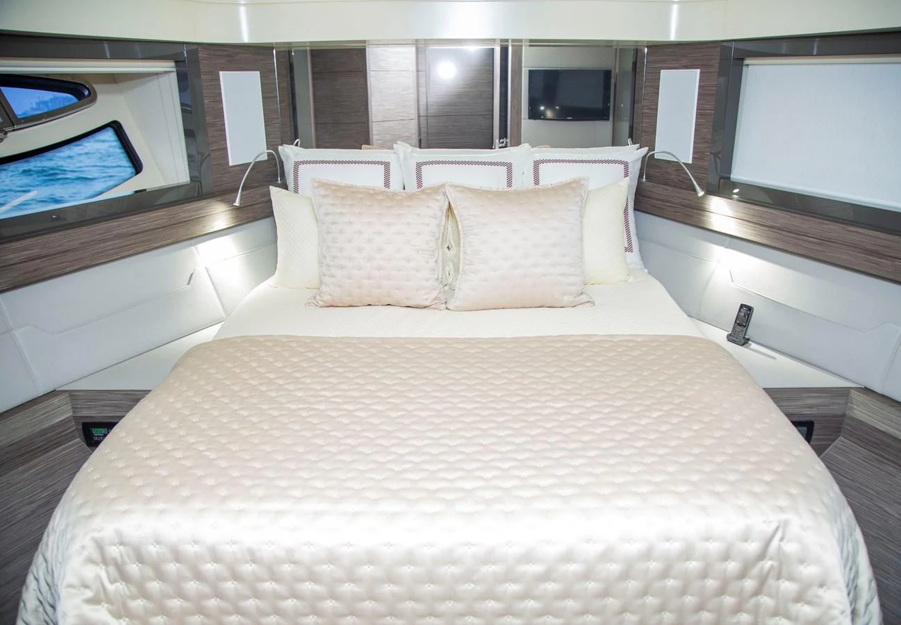 a bed with pillows aboard STRAGA Yacht for Sale
