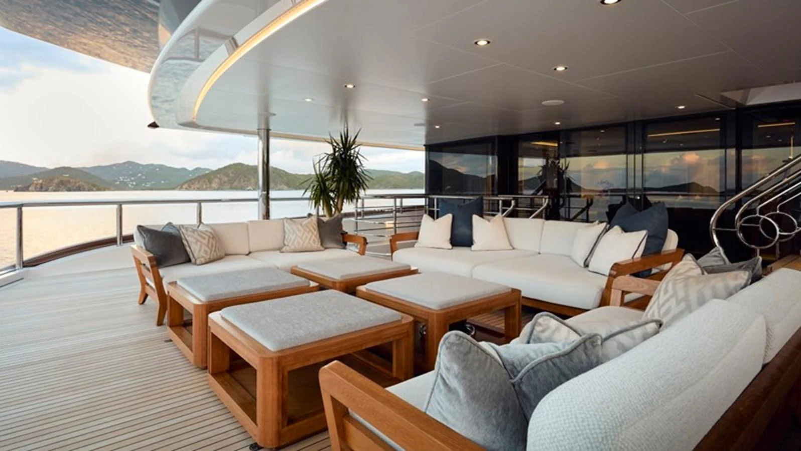 a room with couches and tables aboard VANISH Yacht for Sale