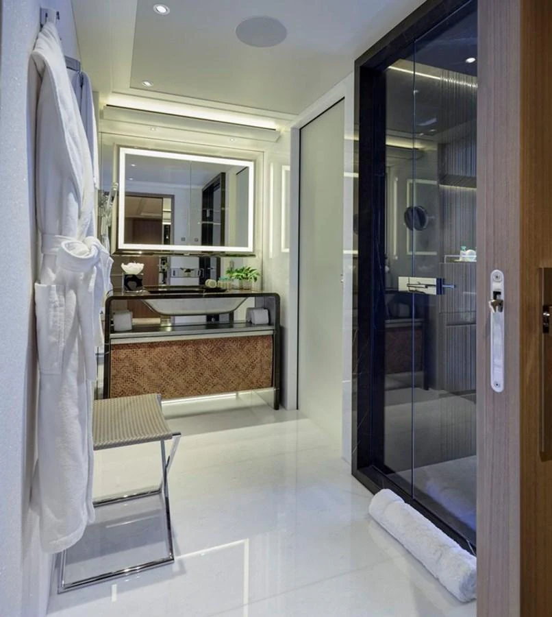 a bathroom with a glass shower aboard VANISH Yacht for Sale