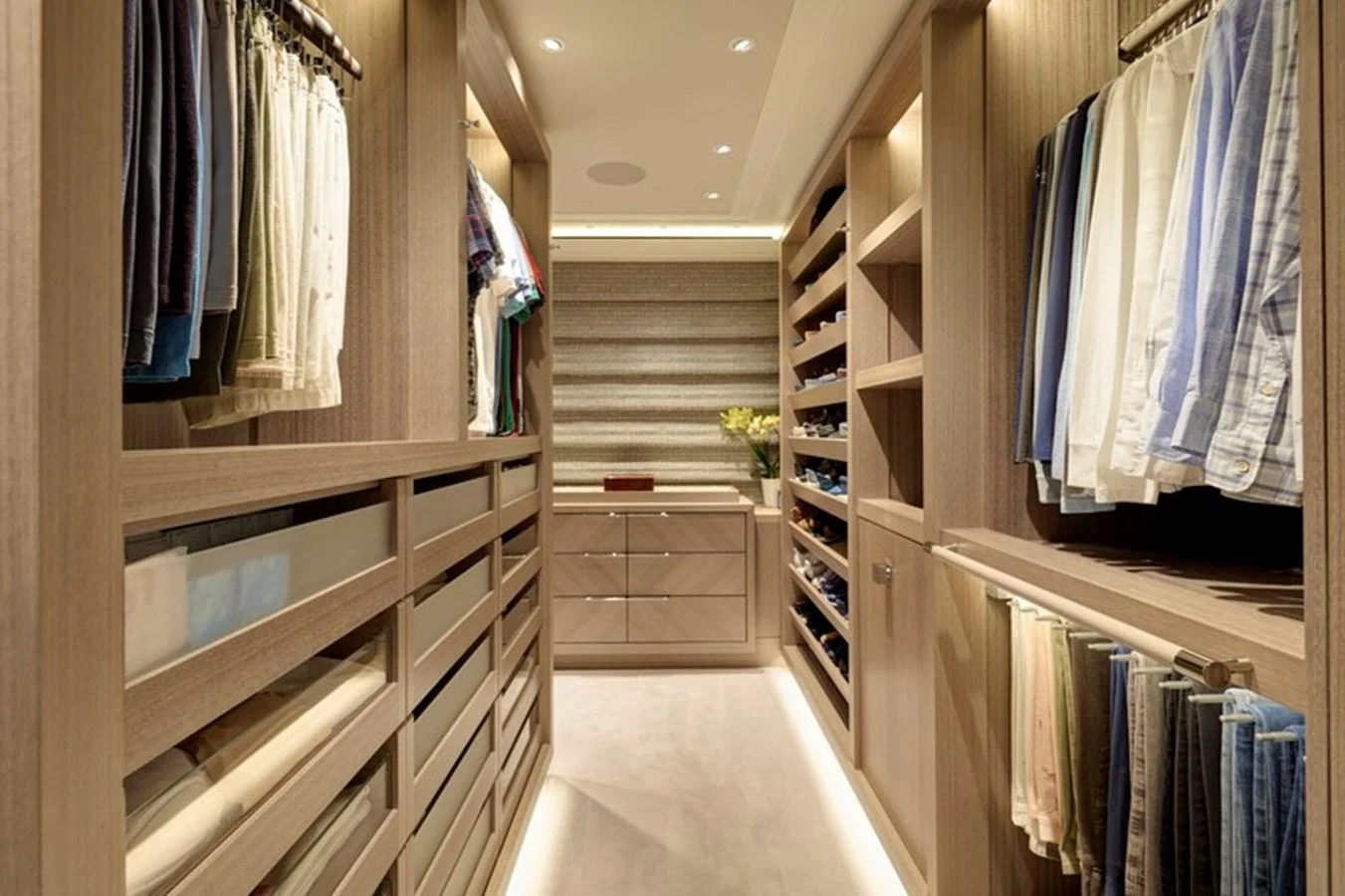 a room with a closet and shelves aboard VANISH Yacht for Sale