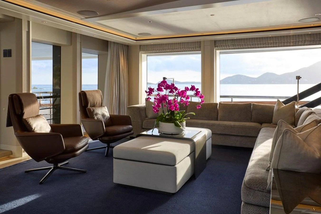 a living room with a couch and a table aboard VANISH Yacht for Sale