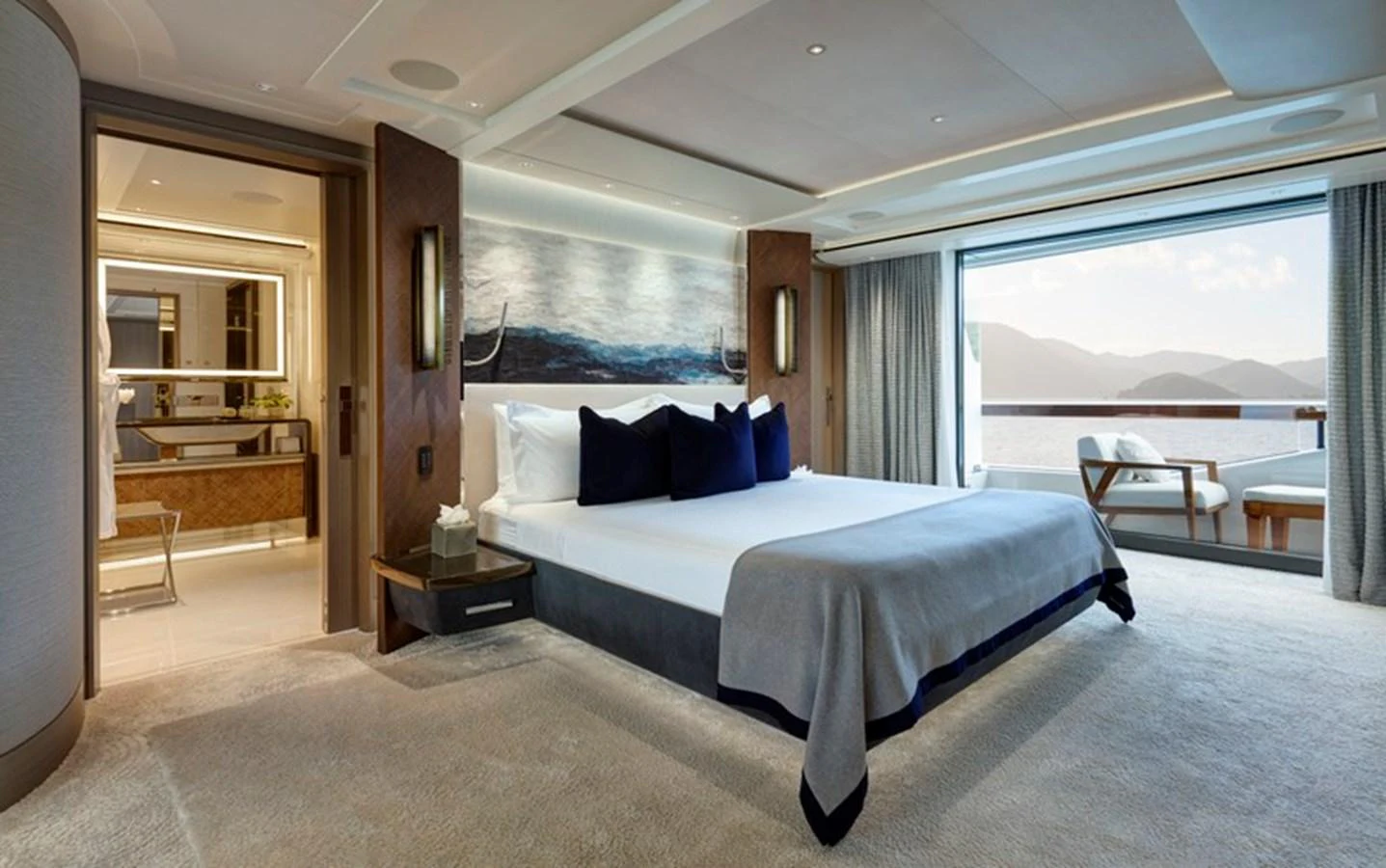 a large bedroom with a large bed aboard VANISH Yacht for Sale