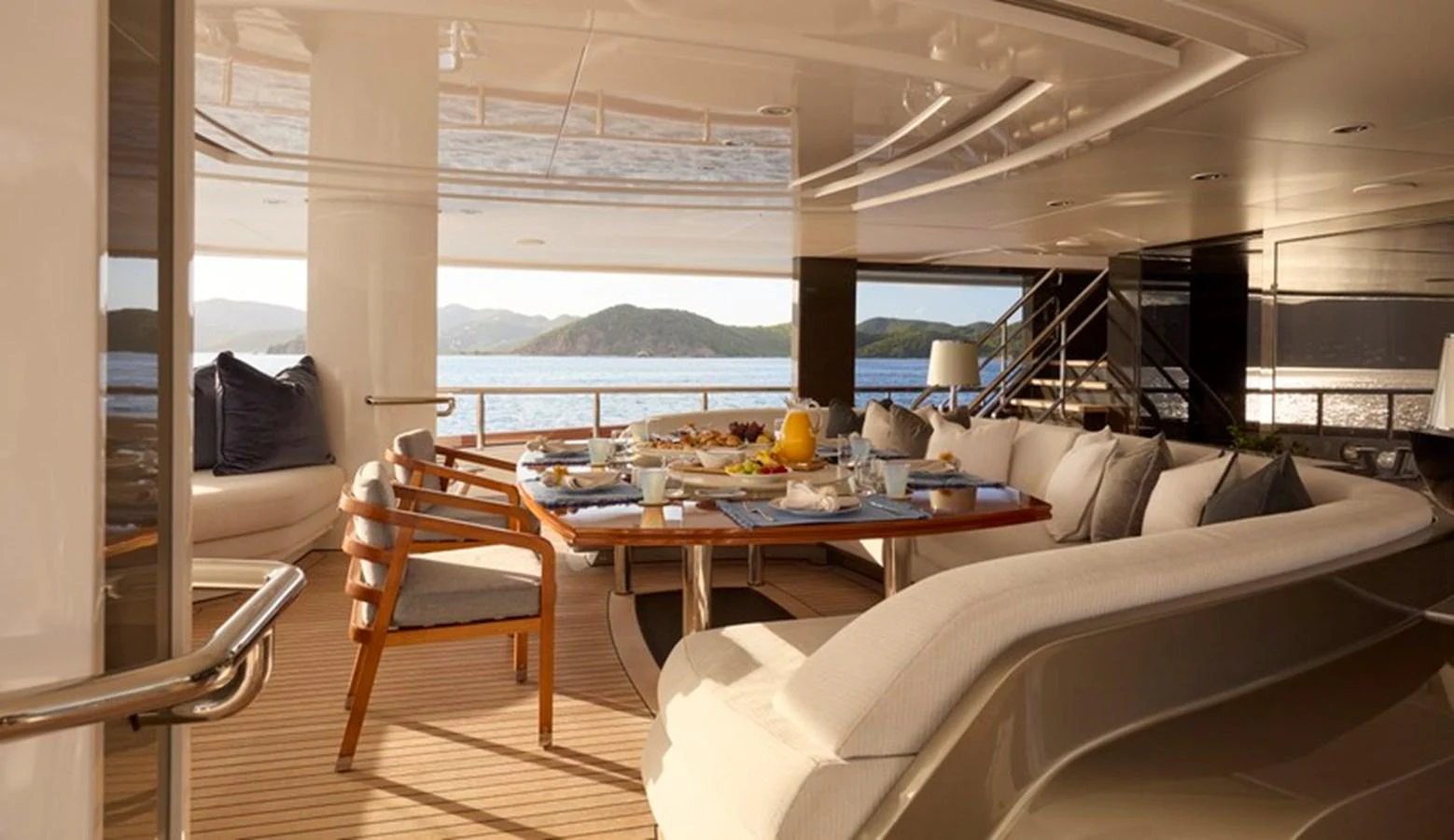 a room with a table and chairs aboard VANISH Yacht for Sale