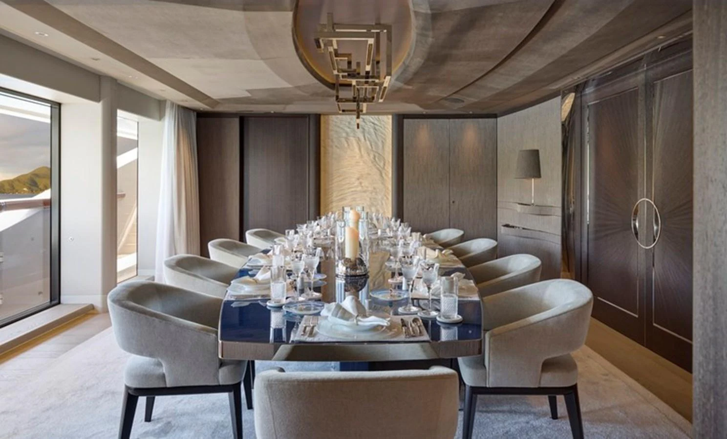 a dining room with a table and chairs aboard VANISH Yacht for Sale